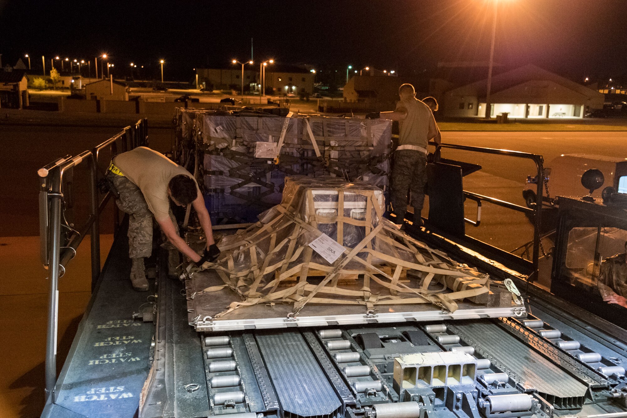 Members of 436th Aerial Port Squadron ramp services section look over cargo netting prior to loading the pallets on an Air Transport International Boeing 757-200 aircraft Sept. 8, 2019, at Dover Air Force Base, Del. The ATI aircraft, part of the Civil Reserve Air Fleet program, was contracted to transport cargo and 30 Team Dover personnel to Fairchild AFB, Wash., participating in Mobility Guardian 2019. “Air Mobility Command’s commercial airlift partners are a vital part of our daily airlift missions around the world as well as our wartime effort,” said Maj. Adam Crane, AMC Headquarters CRAF Branch Chief, Scott AFB, Ill. (U.S. Air Force photo by Roland Balik)