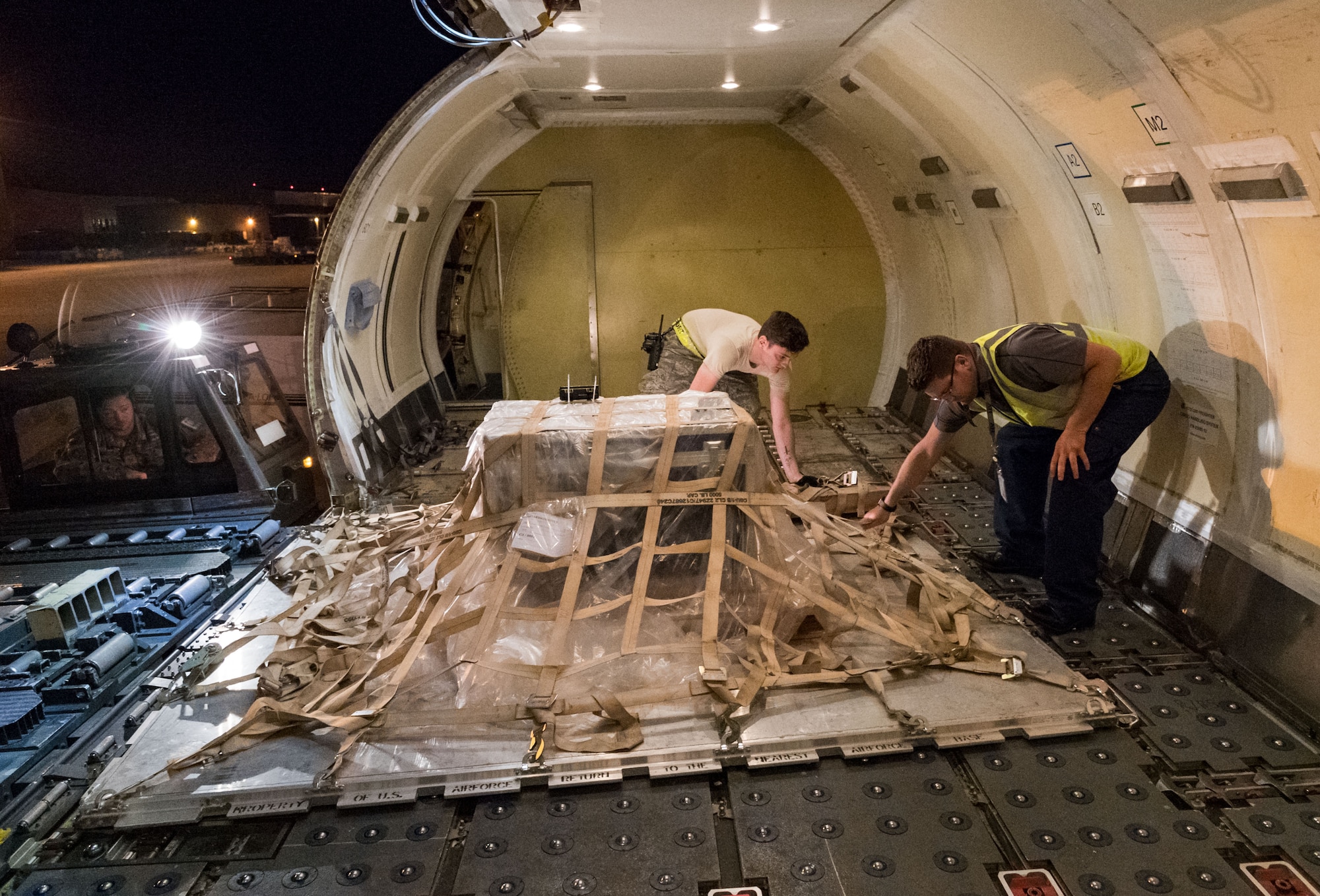 Senior Airman Brandon Sanderell, 436th Aerial Port Squadron ramp services specialist and Brian McDonald, Air Transport International senior loadmaster, position a pallet on an ATI Boeing 757-200 aircraft Sept. 8, 2019, at Dover Air Force Base, Del. The ATI aircraft, part of the Civil Reserve Air Fleet program, was contracted to transport cargo and 30 Team Dover personnel to Fairchild AFB, Wash., participating in Mobility Guardian 2019. “This mission is multidimensional and will provide a greater understanding of the commercial airlift capabilities and requirements across Air Mobility Command and the commercial airlift enterprise,” said Maj. Adam Crane, AMC Headquarters CRAF Branch Chief, Scott AFB, Ill. (U.S. Air Force photo by Roland Balik)