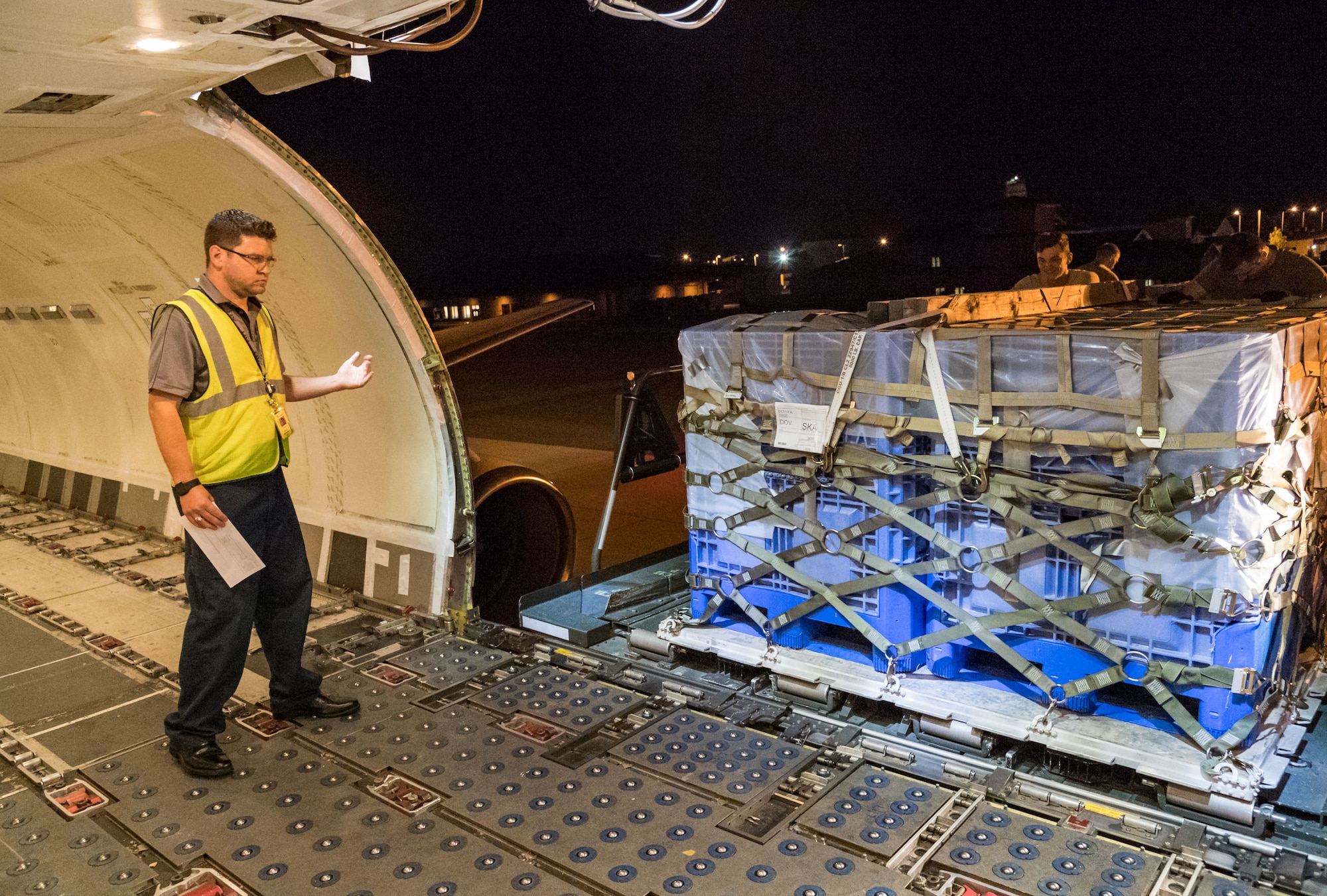 Brian McDonald, Air Transport International senior loadmaster, watches a pallet being loaded Sept. 8, 2019, at Dover Air Force Base, Del. The ATI Boeing 757-200 aircraft was contracted to transport cargo and 30 Team Dover personnel to Fairchild AFB, Wash., participating in Mobility Guardian 2019. “Air Mobility Command’s commercial airlift partners are a vital part of our daily airlift missions around the world as well as our wartime effort,” said Maj. Adam Crane, AMC Headquarters CRAF Branch Chief, Scott AFB, Ill. (U.S. Air Force photo by Roland Balik)