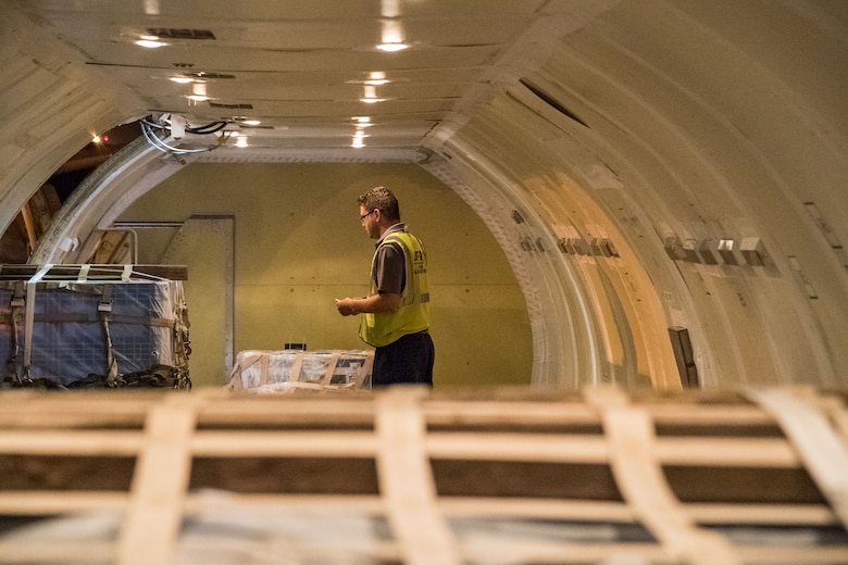 Brian McDonald, Air Transport International senior loadmaster, watches a pallet being loaded Sept. 8, 2019, at Dover Air Force Base, Del. The ATI aircraft, part of the Civil Reserve Air Fleet program, was contracted to transport cargo and 30 Team Dover members to Fairchild AFB, Wash., participating in Mobility Guardian 2019. “In support of exercise Mobility Guardian 2019, Air Mobility Command contracted commercial aircraft to simulate activating CRAF marking the first time, in a long time, AMC has exercised a commercial component of its wartime plan,” said Maj. Adam Crane, AMC Headquarters CRAF Branch Chief, Scott AFB, Ill. (U.S. Air Force photo by Roland Balik)
