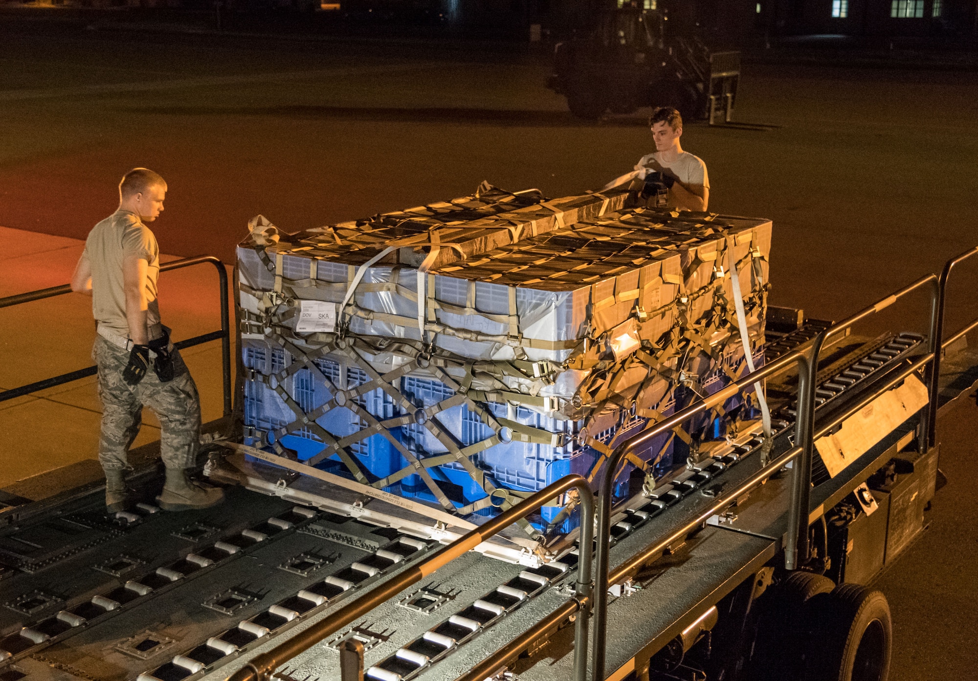 Members of 436th Aerial Port Squadron ramp services section look over cargo netting prior to loading the last pallet onto an Air Transport International Boeing 757-200 aircraft Sept. 8, 2019, at Dover Air Force Base, Del. The ATI aircraft, part of the Civil Reserve Air Fleet program, was contracted to transport cargo and 30 Team Dover members to Fairchild AFB, Wash., participating in Mobility Guardian 2019. “Air Mobility Command’s commercial airlift partners are a vital part of our daily airlift missions around the world as well as our wartime effort,” said Maj. Adam Crane, AMC Headquarters CRAF Branch Chief, Scott AFB, Ill. (U.S. Air Force photo by Roland Balik)