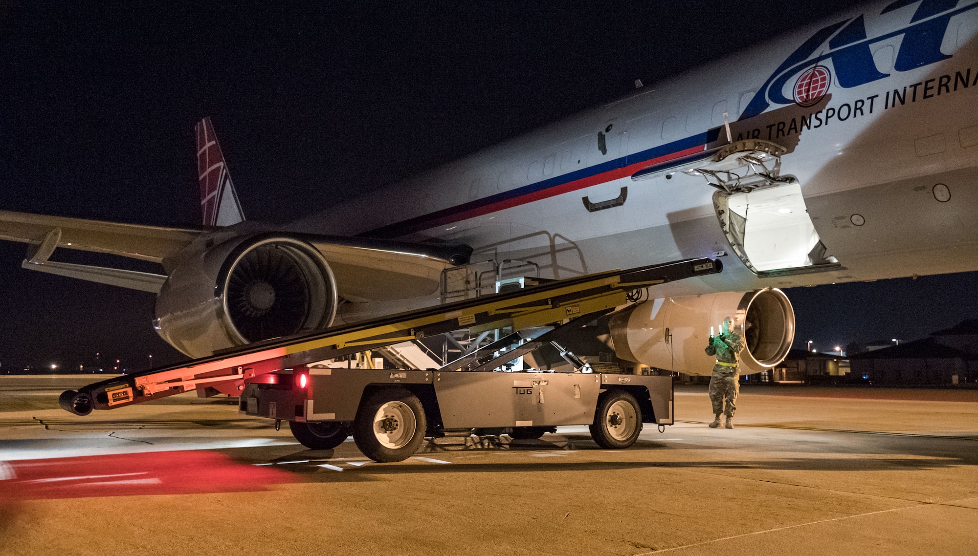 Passenger services personnel from the 436th Aerial Port Squadron load baggage into the lower cargo hold of an Air Transport International Boeing 757-200 Sept. 8, 2019, at Dover Air Force Base, Del. The ATI aircraft, part of the Civil Reserve Air Fleet program, was contracted to transport cargo and 30 Team Dover members to Fairchild AFB, Wash., participating in Mobility Guardian 2019. “This mission is multidimensional and will provide a greater understanding of the commercial airlift capabilities and requirements across Air Mobility Command and the commercial airlift enterprise,” said Maj. Adam Crane, AMC Headquarters CRAF Branch Chief, Scott AFB, Ill. (U.S. Air Force photo by Roland Balik)