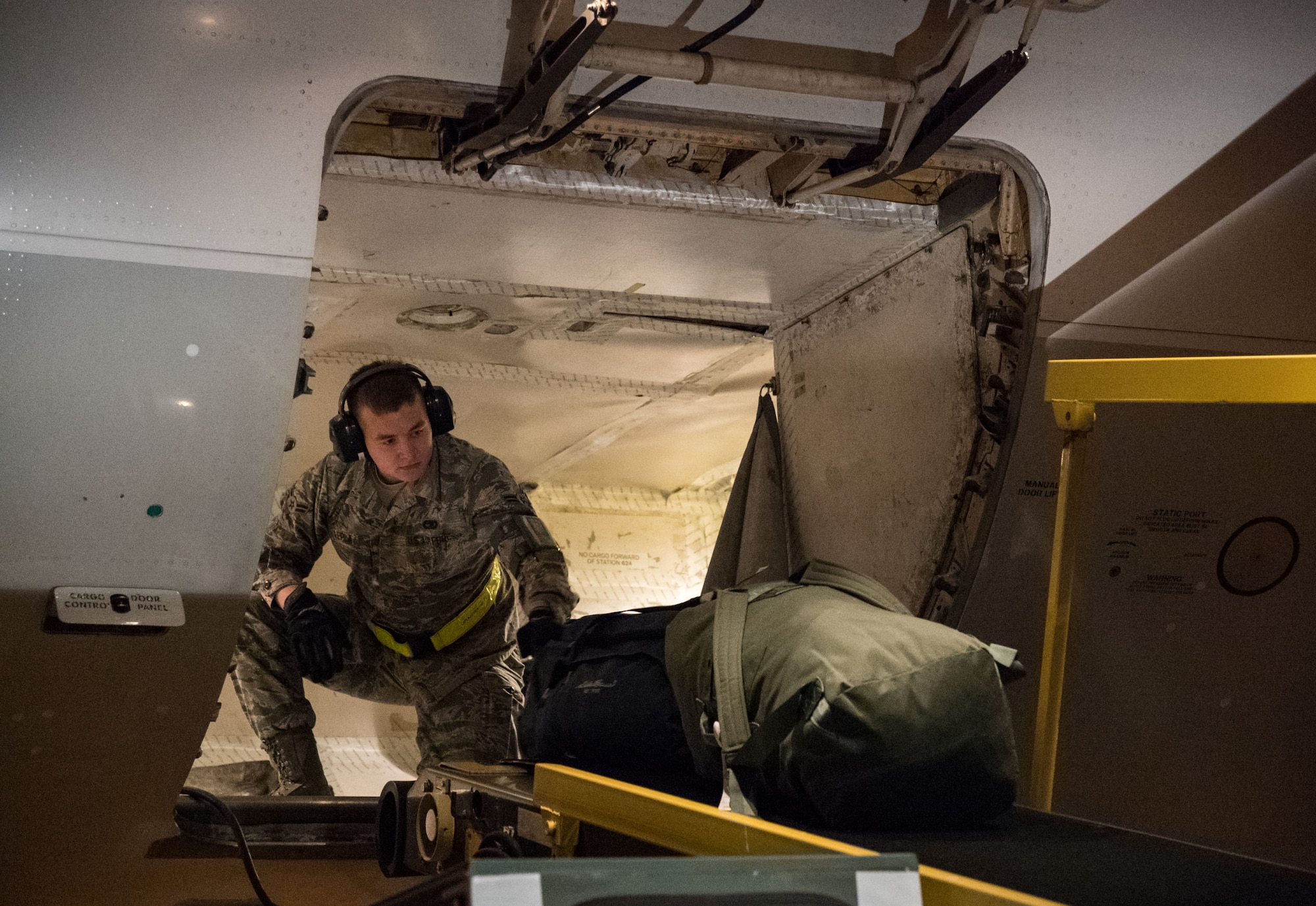 Airman 1st Class Justin Lepla, 436th Aerial Port Squadron passenger services specialist, loads baggage into the lower cargo hold of an Air Transport International Boeing 757-200 Sept. 8, 2019, at Dover Air Force Base, Del. The ATI aircraft, part of the Civil Reserve Air Fleet program, was contracted to transport cargo pallets and 30 Team Dover members to Fairchild AFB, Wash., participating in Mobility Guardian 2019. “In support of exercise Mobility Guardian 2019, Air Mobility Command contracted commercial aircraft to simulate activating CRAF marking the first time, in a long time, AMC has exercised a commercial component of its wartime plan,” said Maj. Adam Crane, AMC Headquarters CRAF Branch Chief, Scott AFB, Ill. (U.S. Air Force photo by Roland Balik)