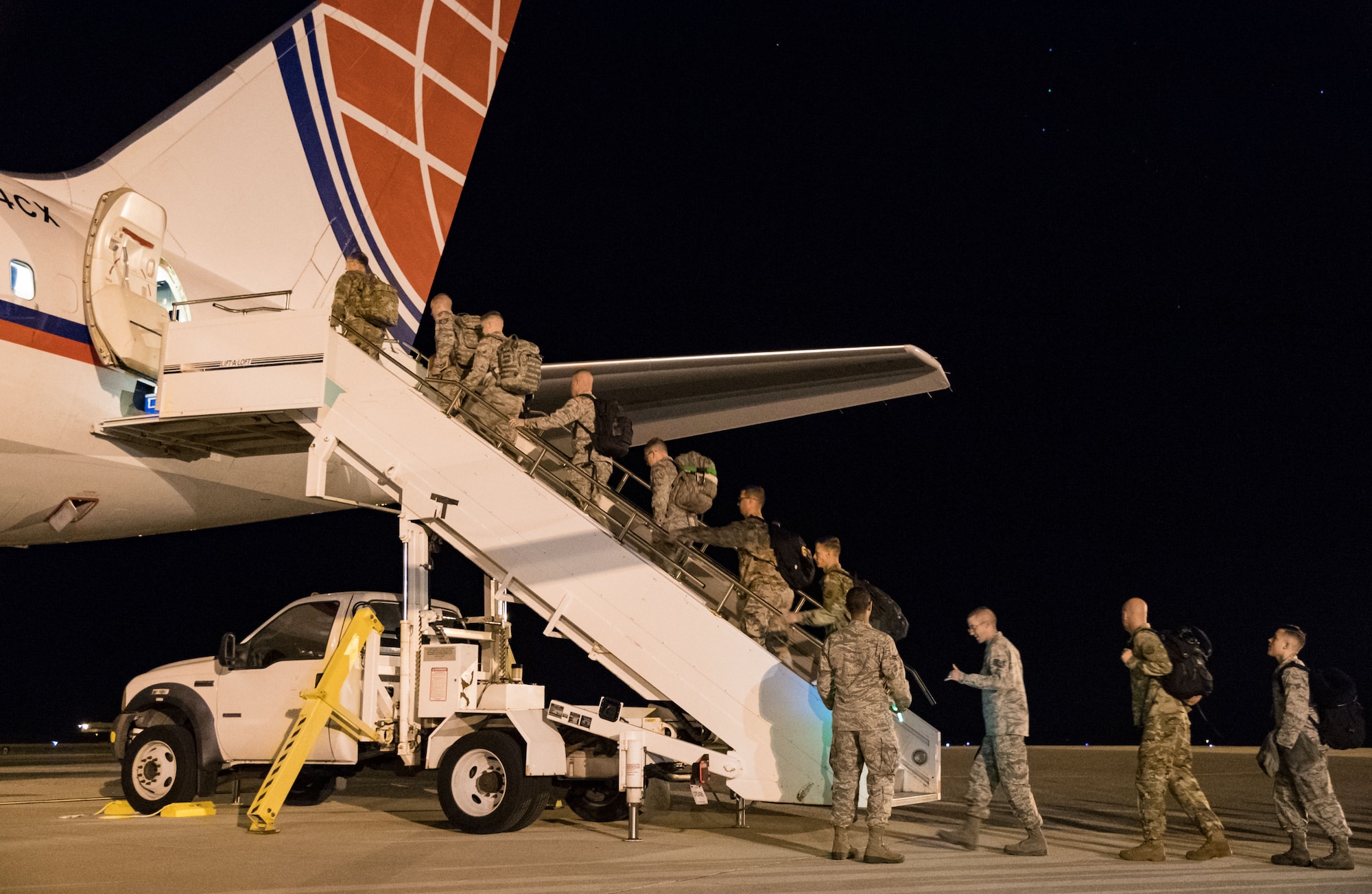 Team Dover members use the step truck to enter the passenger seating section of an Air Transport International Boeing 757-200 Sept. 8, 2019, at Dover Air Force Base, Del. The ATI aircraft, part of the Civil Reserve Air Fleet program, was contracted to transport cargo and 30 Team Dover members to Fairchild AFB, Wash., participating in Mobility Guardian 2019. “Air Mobility Command’s commercial airlift partners are a vital part of our daily airlift missions around the world as well as our wartime effort,” said Maj. Adam Crane, AMC Headquarters CRAF Branch Chief, Scott AFB, Ill. (U.S. Air Force photo by Roland Balik)