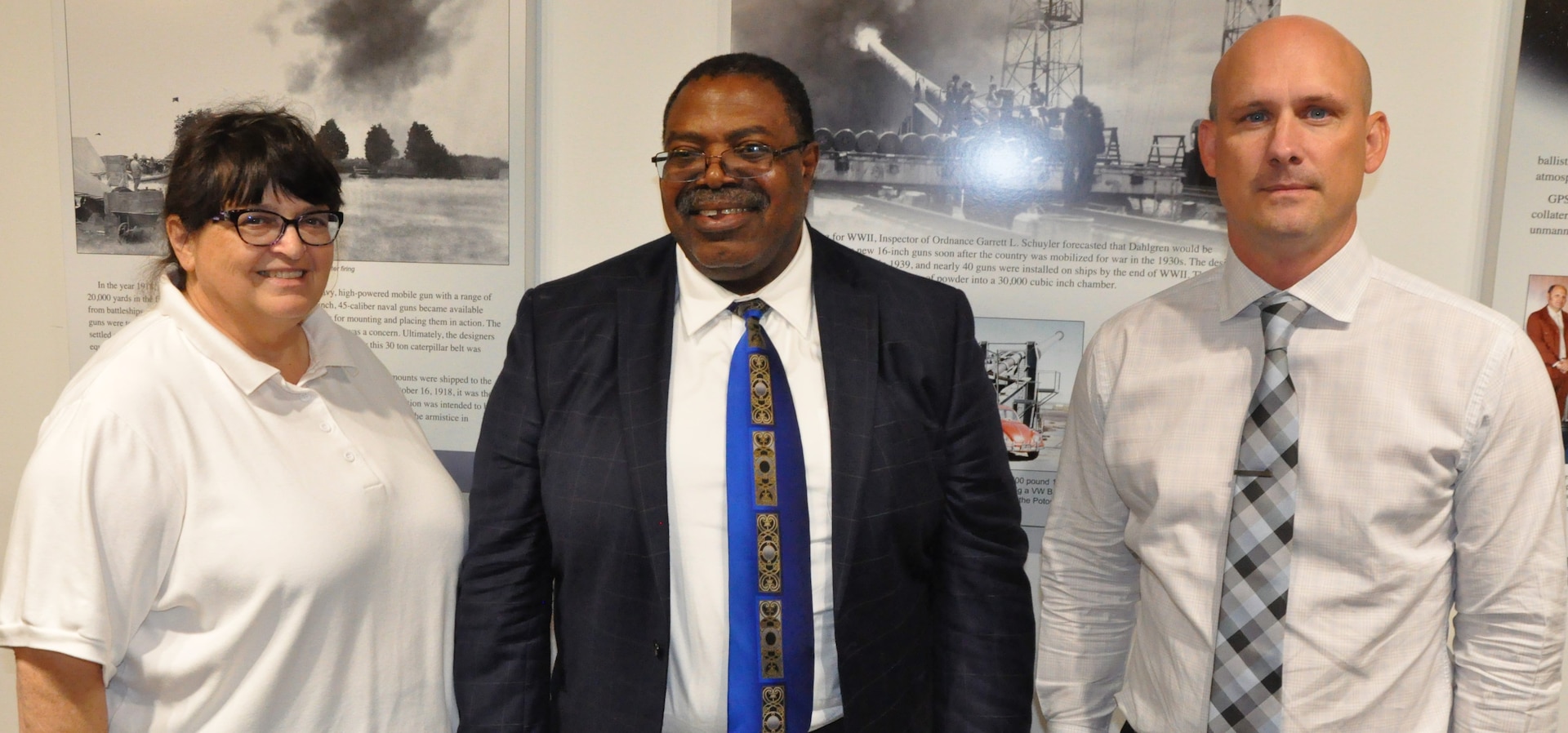 IMAGE: KING GEORGE, Va. (Aug. 20, 2019) - Dr. James Elele – a leading expert in the field of Verification, Validation, and Accreditation (VV&A) – is flanked by Naval Surface Warfare Center Dahlgren Division (NSWCDD) engineers Bonita Davia and Sam Koski at a two-day seminar sponsored by the NSWCDD Modeling and Simulation Community of Interest. Elele briefed about 115 scientists and engineers attending the VV&A seminar from NSWCDD, NSWCDD Dam Neck Activity, NSWC Indian Head Explosive Ordnance Disposal Technology Division, Marine Corps Systems Command, and Naval Air Station Patuxent River at the University of Mary Washington Dahlgren campus.  The course brought together a huge diversity of modeling and simulation disciplines to collaborate and learn approaches to verification, validation, and accreditation.