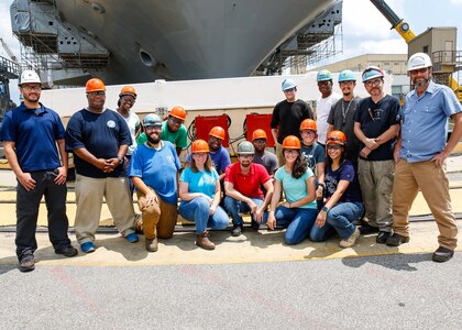 The following are the original crew from the very beginning of the project to the closing of the last box containing the system, and other notable names: Electrical Code 950: Amanda Herron, Jermone Rider, Veronica Outlaw, Torrey KcKinney, Lisa Defiore, Rahkeem Jackson, Mikeya Backus, Brett Hinton, Blesdimir Hernandez, Jason Whitford, Ronnie Wills, *Keona Bellamy,*Saige Berreto,*J’aira Davis, *Blair Balestino; Temp Service Code 990: David Stevens, Daniel Peak, Matthew Moskowitz, Ronald Hill, Christopher Blake, Lascelles Bond, Mattew Stephenson, James Robinson; Operations Code C300: Mike Robinson; and Carrier IC, Weapons, and Fire Control Code C271: Thomas Colasurdo and Mark Shewmaker. 
*Those with asterisks next to their names are apprentices