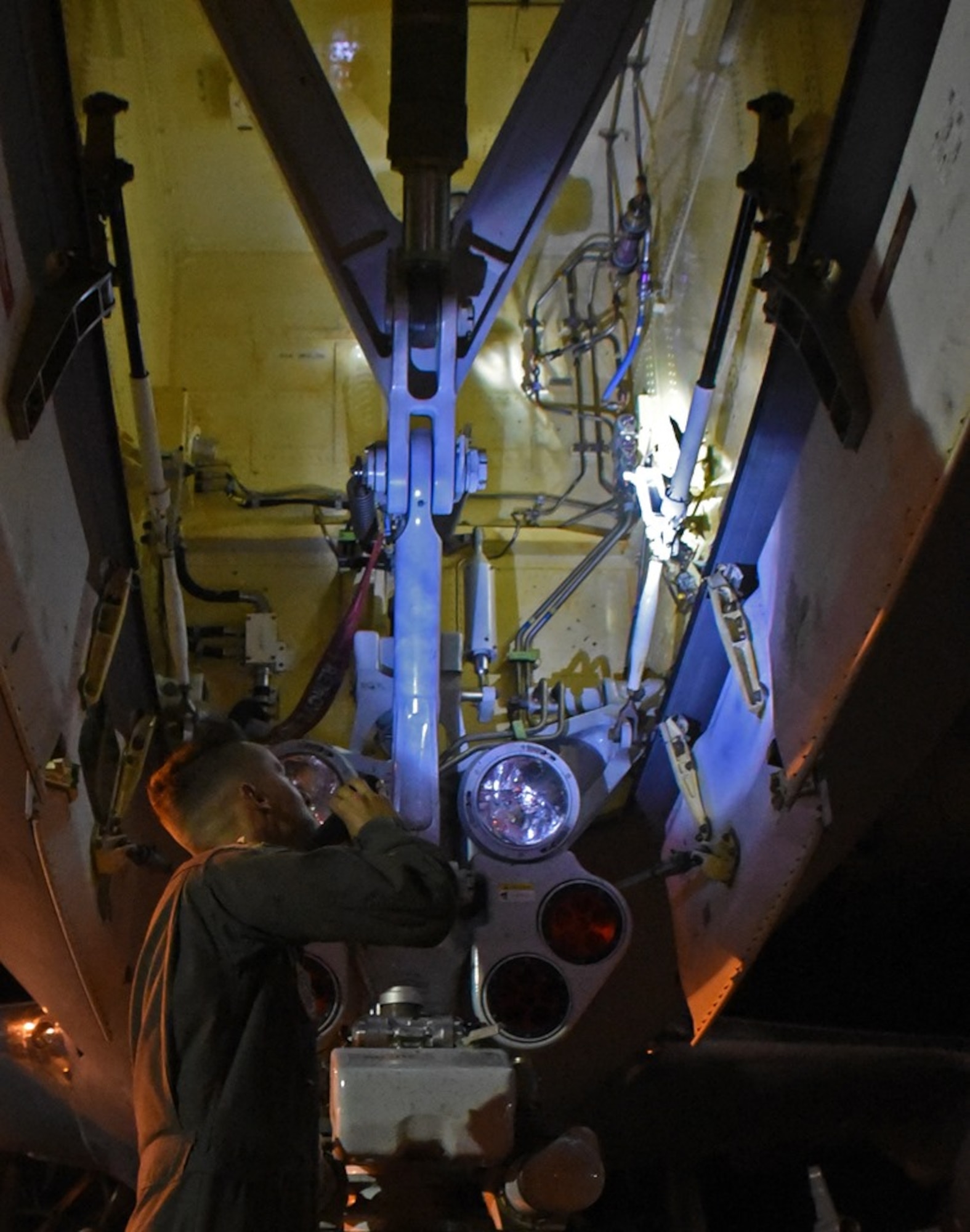 U.S. Air Force Staff Sgt. Eric Yates, 22nd Aircraft Maintenance Squadron crew chief from McConnell Air Force Base, Kansas, conducts a post-flight check of a KC-46 Pegasus Aug. 21, 2019, at Travis AFB, California. Yates, along with the rest of the KC-46 crew, worked with Travis' 60th Aerial Port Squadron to load the aircraft with life rafts and other cargo for the U.S. Navy's USS Port Royal. (U.S. Air Force photo by Senior Airman Christian Conrad)