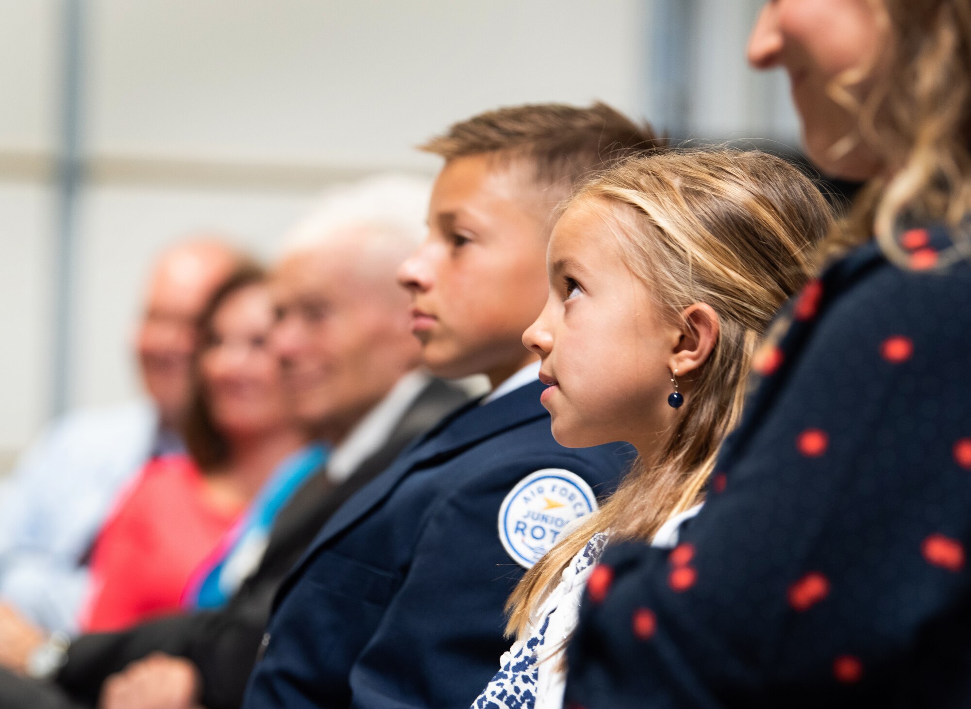 Maj. Scott Hollister’s family watch as he receives his new rank during a promotion ceremony Sept. 8, 2019