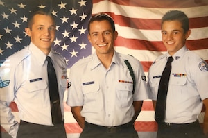 The three Hollister brothers, Scott (left), Ryan (middle) and Taylor pose for a photo together in 2005.