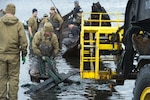 Navy Divers Clear Fishing Vessel from Alaska Harbor in Arctic Exercise