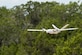 An unmanned aerial system flies over Camp Bullis, Texas, during a field test Sept. 4. The UAS was equipped with Light Detection and Ranging, multi-spectral sensors and machine-learning algorithms to map, survey and inventory habitat for the golden-cheeked warbler. The field test will help the Air Force determine if UAS technology can characterize habitat better, faster and cheaper than current methods.