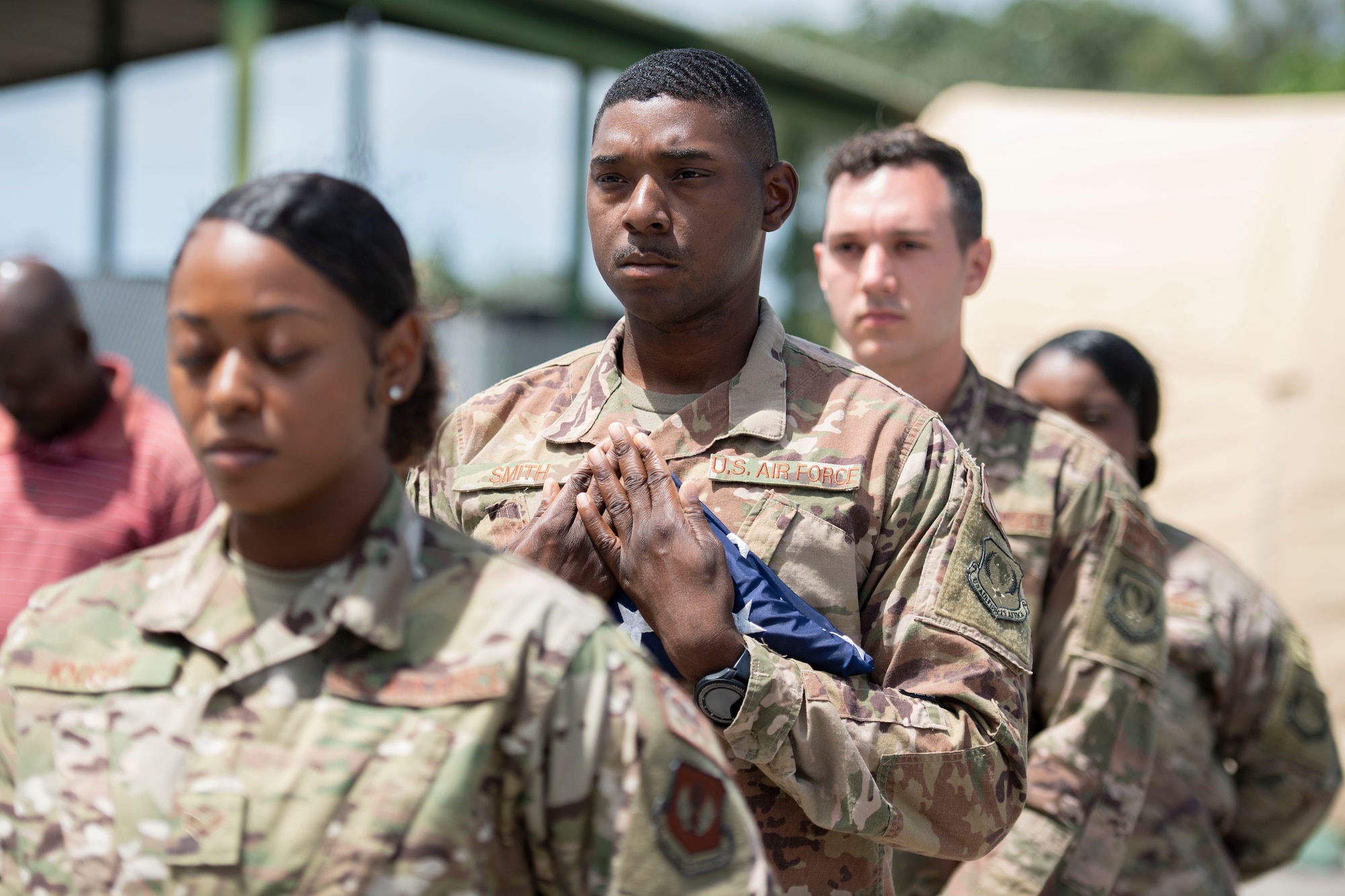 U.S. Air Force Airmen from the 475th Expeditionary Air Base Squadron perform flag detail during a ceremony at Camp Simba, Kenya, Aug. 26, 2019. The 475th EABS raised the flag for the first time since the base operating support-integrator mission started in 2017, signifying the change from tactical to enduring operations. (U.S. Air Force photo by Staff Sgt. Lexie West)