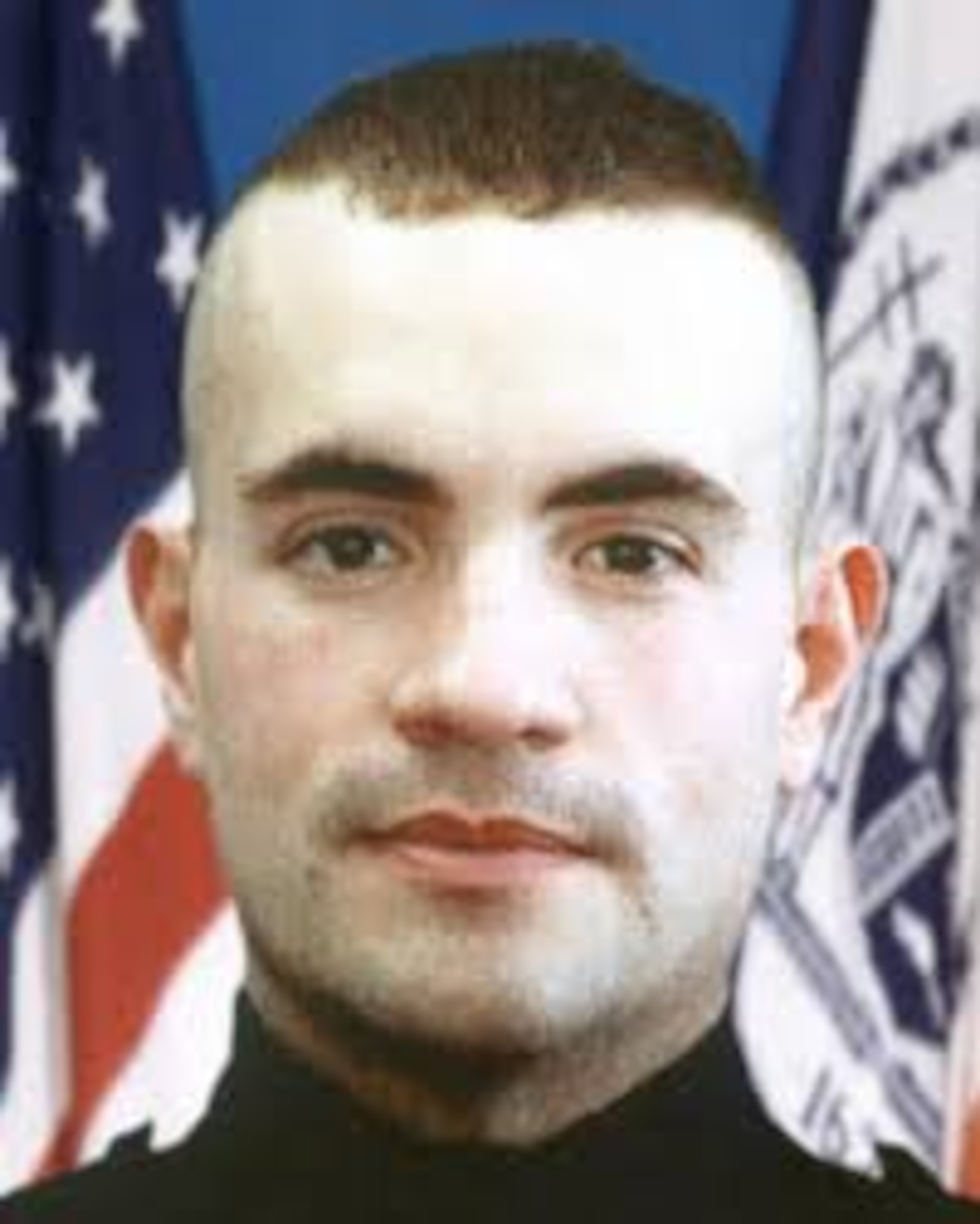 Portrait photo of Staff Sgt. Jerome Dominguez in police uniform.