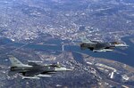 Two US Air Force (USAF) F-16C Fighting Falcon aircraft from the 121st Fighter Squadron, 113th Wing, District of Columbia (DC) Air National Guard (ANG), fly over the nation’s Capital, during a Combat Air Patrol mission in support of Operation NOBLE EAGLE.