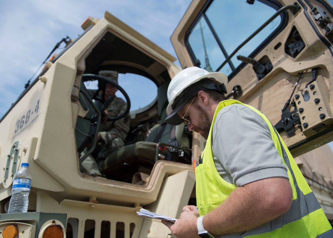 A Port of Virginia dockworker takes notes during training for a cargo transportation exercise at Fort Story, Virginia, Aug. 20, 2019.
