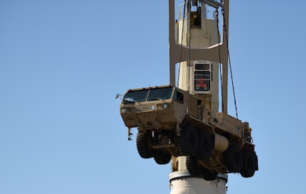 A Port of Virginia dockworker unloads a military vehicle during a cargo transportation exercise at the Hampton Roads Portsmouth Marine Terminal in Portsmouth, Virginia, Aug. 31, 2019.