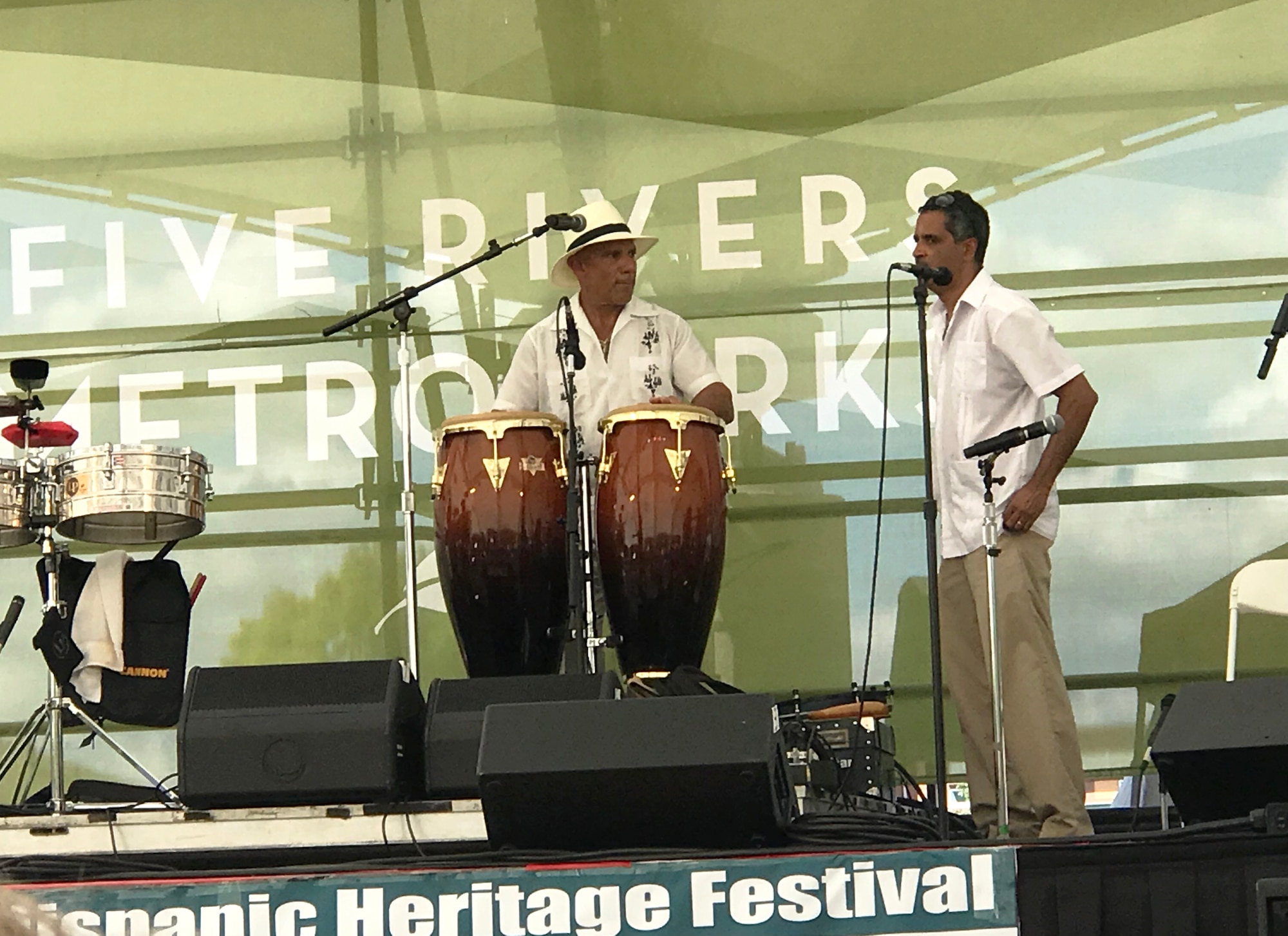 Air Force Research Laboratory Aerospace Systems Directorate Diversity Council Chair Miguel Maldonado (left) and Senior Research Engineer Edwin Corporan prepare to take the stage at the 2018 Hispanic Heritage Festival in Dayton, Ohio. Maldonado is leading the directorate’s Hispanic Heritage Month activities, taking place Sept. 15-Oct. 15, 2019. (Photo courtesy of Maria Maldonado)