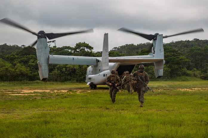 Marines with Echo Company, Battalion Landing Team, 2nd Battalion, 1st Marines, 31st Marine Expeditionary Unit, exit an MV-22B Osprey tiltrotor aircraft during a long-range raid in the Central Training Area, Okinawa, Japan, Aug. 14, 2019. The 31st MEU and Amphibious Squadron 11, aboard Wasp Amphibious Ready Group ships, conducted a series of sequential operations which simulated naval expeditionary combined-arms maneuver from amphibious assets to shore, utilizing Marine Air-Ground Task Force capabilities integrated across all warfighting domains.