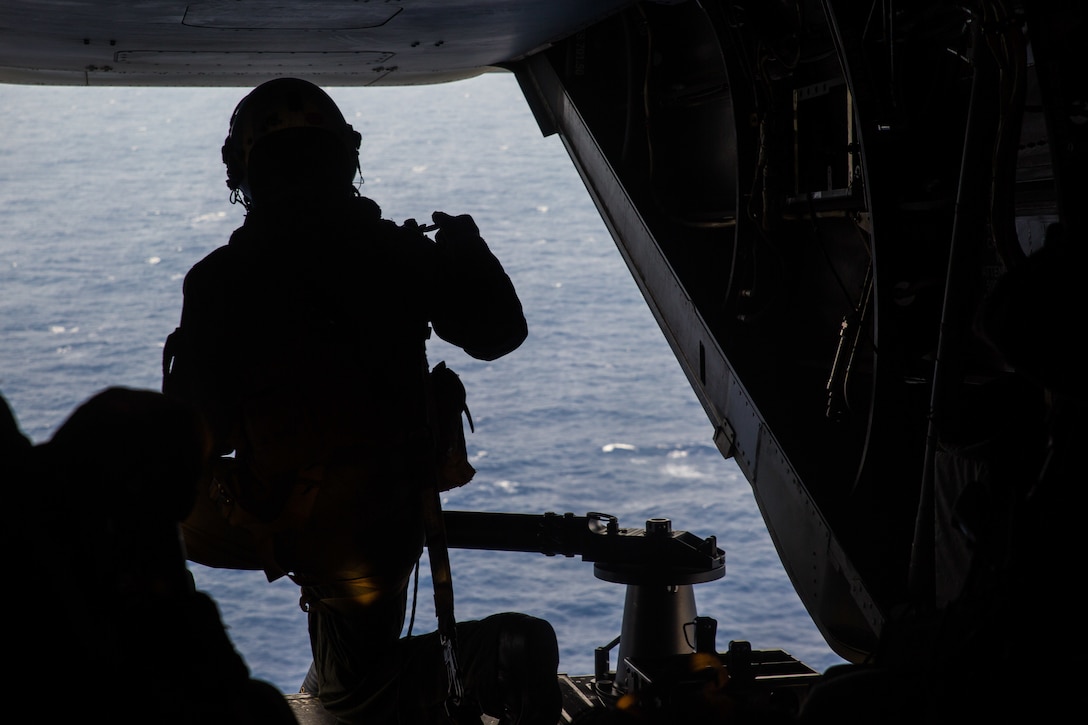 A Marine with Marine Medium Tiltrotor Squadron 265, 31st Marine Expeditionary Unit, prepares to fire an M240B medium machine gun after a simulated long-range raid over the Philippine Sea, Aug. 14, 2019. The 31st MEU and Amphibious Squadron 11, aboard Wasp Amphibious Ready Group ships, conducted a series of sequential operations which simulated naval expeditionary combined-arms maneuver from amphibious assets to shore, utilizing Marine Air-Ground Task Force capabilities integrated across all warfighting domains.