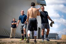 Competitors show support for each other during the DriTri Fitness Competition Sept. 6, 2019, at Schriever Air Force Base, Colorado.