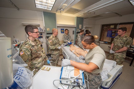 Army and Air Force doctors assess a simulated trauma patient at Brooke Army Medical Center, Joint Base San Antonio-Fort Sam Houston Sept. 4, 2019. Military doctors from around the country attended training at BAMC for validation training for the Army’s Individual Common Task List and the Air Force Comprehensive Medical Readiness Program requirements.