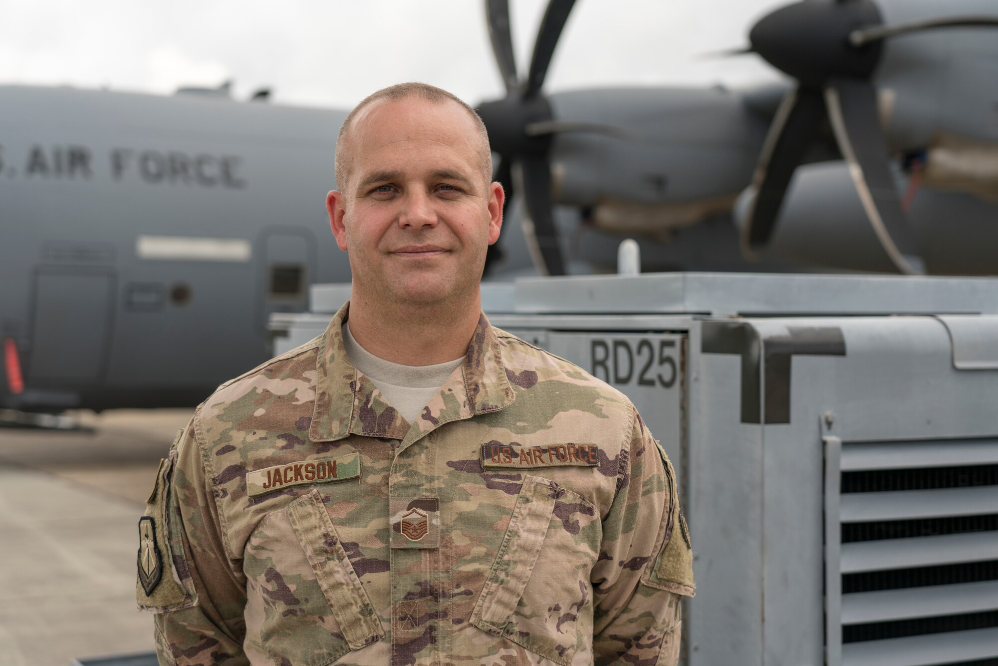 Master Sgt. Tauston Jackson, 403rd Maintenance Squadron aerospace ground equipment superintendent, poses for a photo in front of WC-130J Super Hercules aircraft, Aug. 13, 2019 at Keesler Air Force Base, Mississippi. Jackson was selected as the 403rd Wing’s second quarter award winner in the senior noncommissioned officer category. (U.S. Air Force photo by Tech. Sgt. Christopher Carranza)