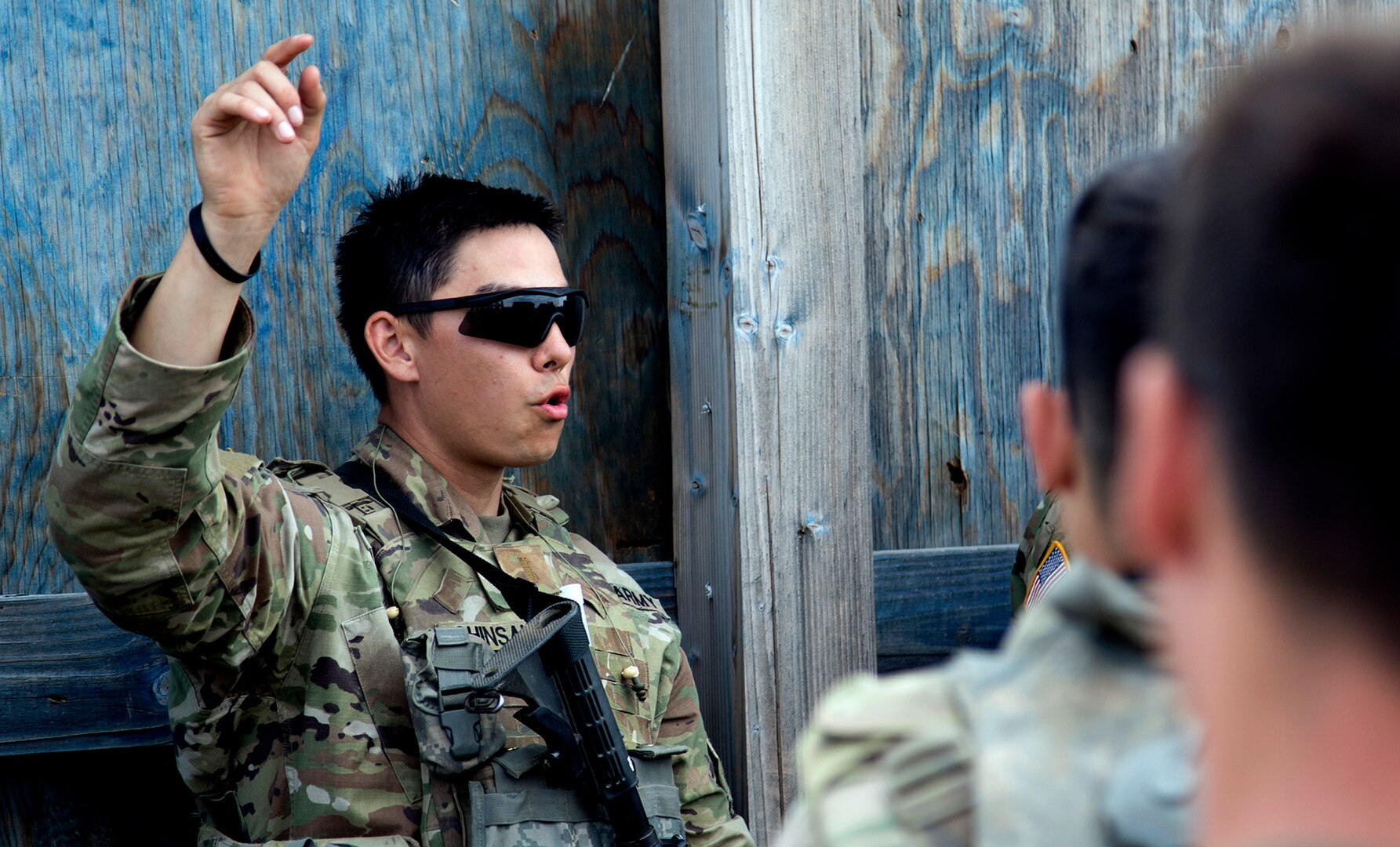 2nd Lt. Andrew Shinsako, platoon leader for Alpha Company, 1st Platoon, 1st Battalion, 178th Infantry Regiment provides feedback to his troops after a blank fire interation during Rising Thunder 19.