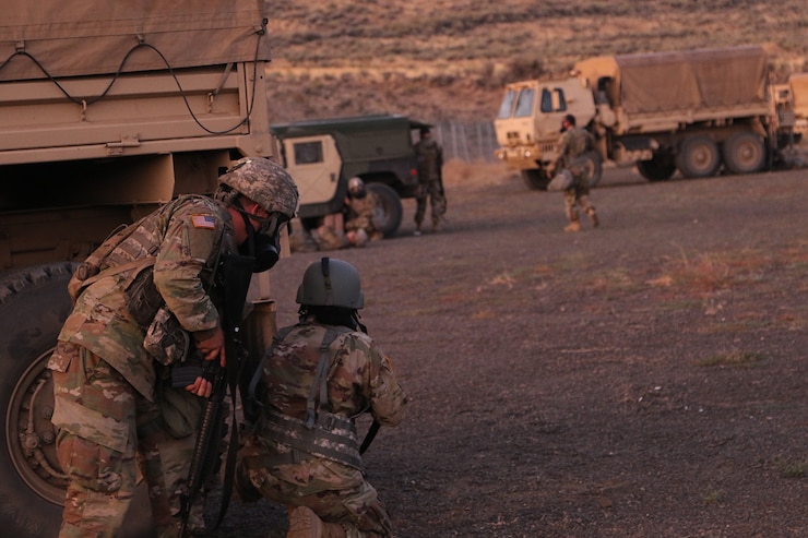 Soldiers from the 1844th Transportation Company, 108th Sustainment Brigade, and medics from the 33rd Infantry Brigade Combat Team, both part of the Illinois Army National Guard, face a chemical attack and small arms fire engagement during their morning base defense.