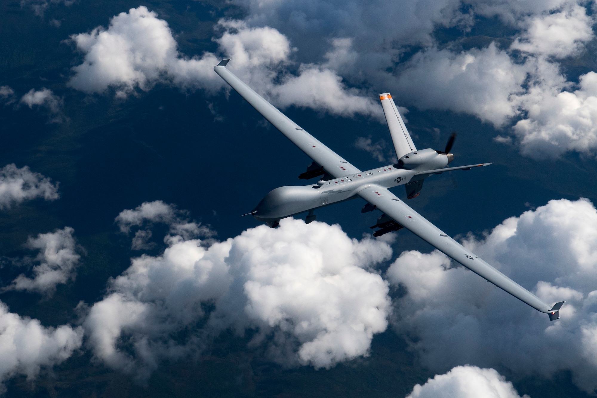 A U.S. Air Force MQ-9 Reaper flies during RED FLAG-Alaska 19-2, June 19 2019, at Eielson Air Force Base, Alaska.  This is the first time the MQ-9 aircraft participated in the Pacific Air Forces-sponsored exercise. The aircraft was controlled by Airmen of the 174th Attack Wing more than 4,000 miles away at their home station at Hancock Air Force Base, New York. (U.S. Air Force photo by Senior Airman Daniel Snider)