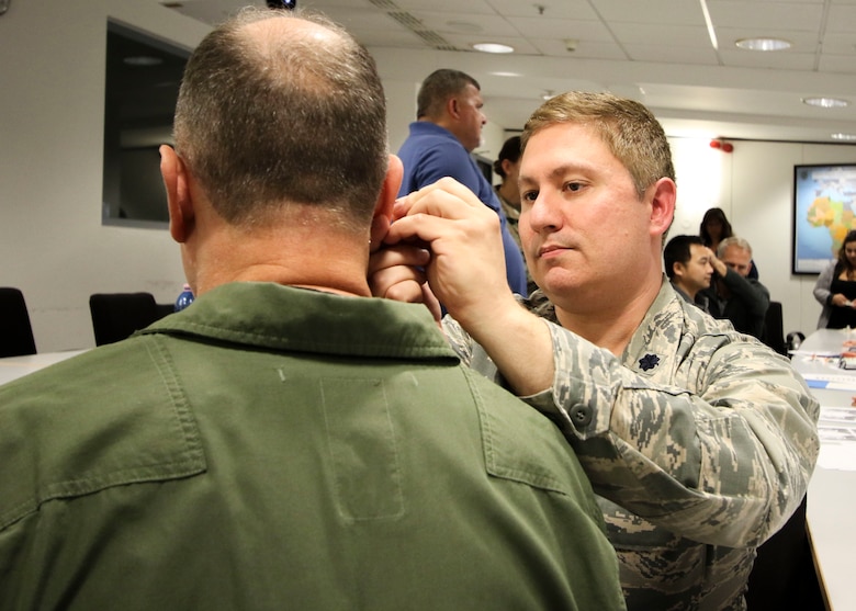 U.S. Air Force Lt. Col. James Cox, chief of medical staff and internal medicine physician, 31st Medical Group, Aviano Air Base, Italy, practices acupuncture as a form of pain management during Landstuhl Regional Medical Center’s Traumatic Brain Injury and Rehabilitation Clinic’s TBI Champion Training Conference, at Ramstein Air Base, Germany, Sept. 6. The three-day conference assembled medical professionals across Europe and Western Asia to promote standardization of TBI clinical care by sharing knowledge, current recommendations and best practices. (Photo by Marcy Sanchez)