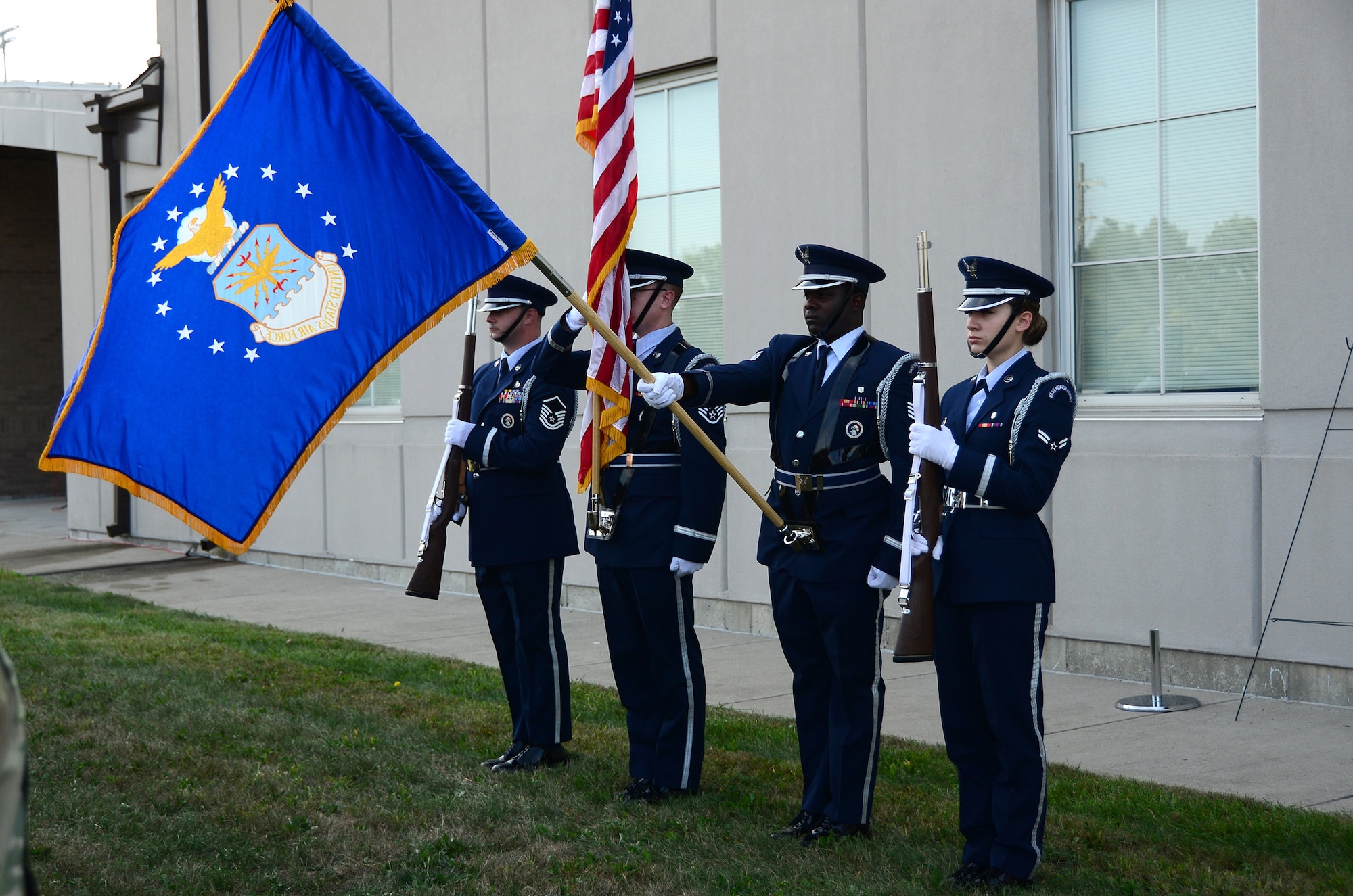 The 445th Airlift Wing Honor Guard presents the Colors in front of the Maj. LeRoy Homer, Jr. Operations Building Sept. 11, 2019 during a Patriot Day ceremony. More than 100 members of the wing gathered on the lawn of the Major LeRoy W. Homer, Jr. Operations building to honor those who lost their lives Sept. 11, 2001