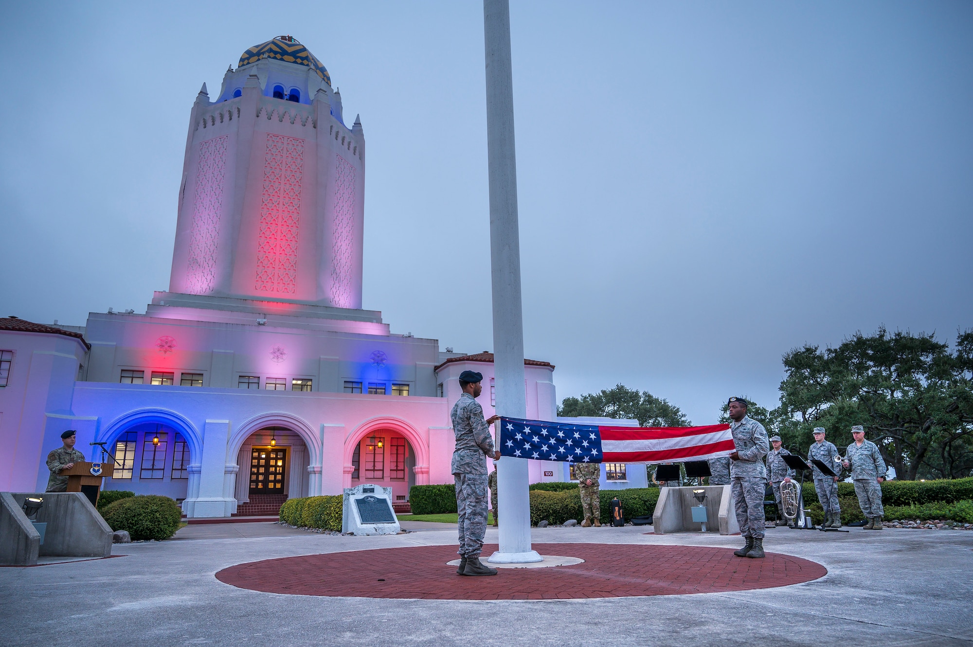 Airman 1st Class Jalen Anderson (left) and Senior Airman Marcus Allen fold a flag during a 9/11 remembrance ceremony Sept. 11 at Joint Base San Antonio-Randolph. The event honored those who lost their lives in New York City, Washington D.C. and Pennsylvania during terrorist attacks 18 years ago.