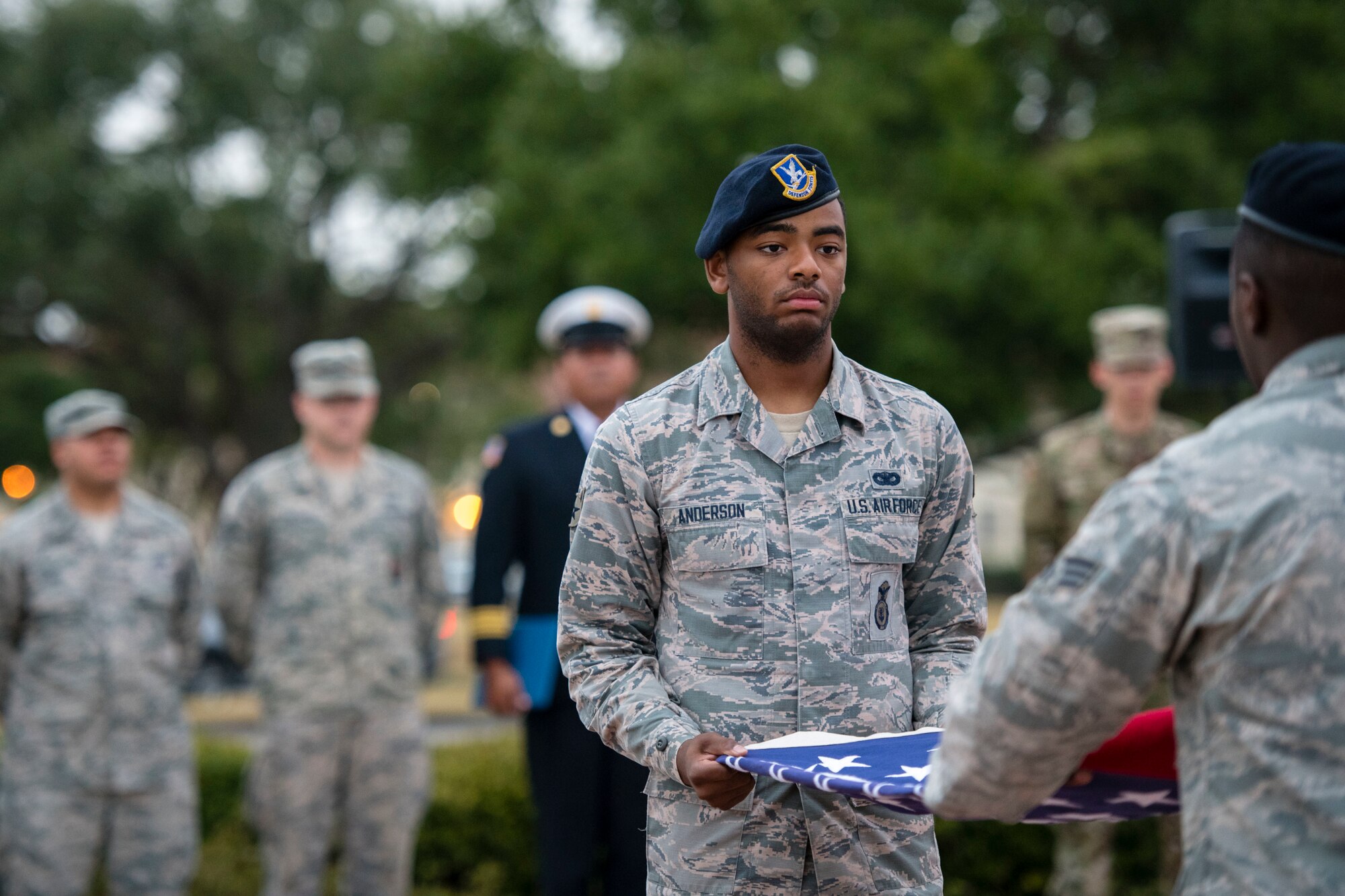 Airman 1st Class Jalen Anderson folds a flag during a 9/11 remembrance ceremony Sept. 11 at Joint Base San Antonio-Randolph. The event honored those who lost their lives during terrorist attacks in New York City, Washington D.C. and Pennsylvania 18 years ago.