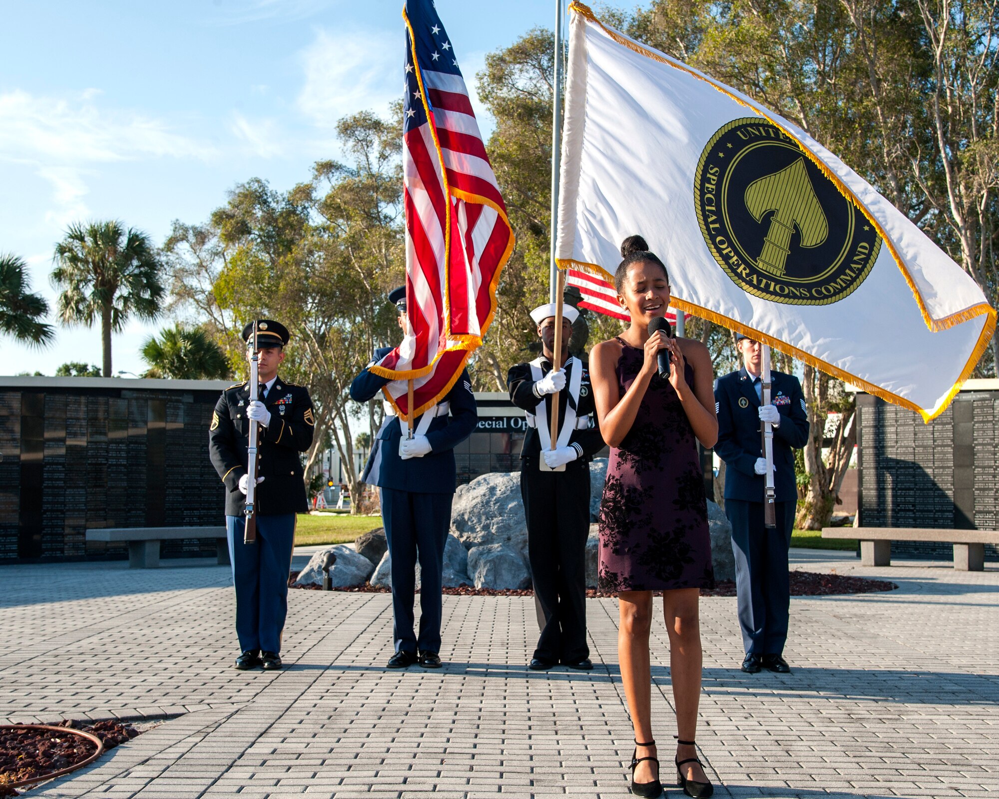 Marlee Michael performs the National Anthem during the 18th annual 9/11 memorial ceremony and ruck march at MacDill Air Force Base, Fla., Sept. 11, 2019.