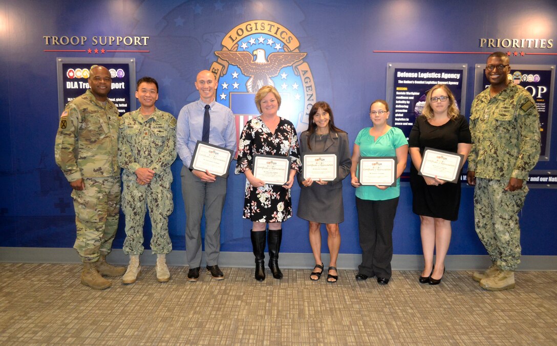 Army Lt. Col. Sherdrick Rankin, DLA Troop Support Europe and Africa commander, left, recognizes members of the Procurement Process Support team for their outstanding dedication and support to the Troop Support Europe and Africa organization.