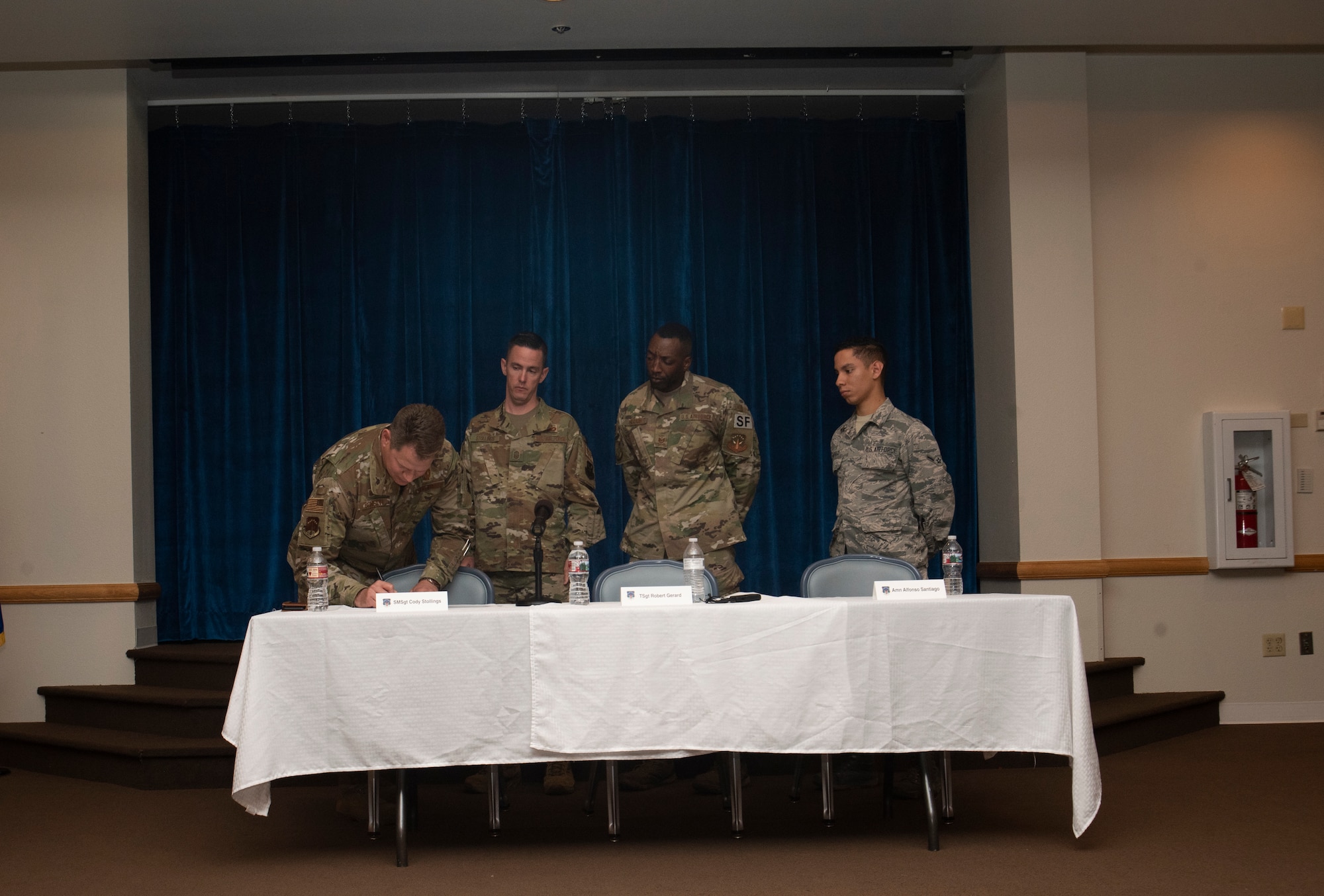Colonel Peter Bonetti, 90th Missile Wing commander, signs a proclamation, recognizing Suicide Prevention Month and asking the Airmen of F.E. Warren to be there for each other while taking an active role in suicide prevention Sept. 10, 2019, at F.E. Warren Air Force Base, Wyo. The proclamation was signed during a story telling event, allowing a panel of Airmen to share their personal stories of resiliency and strength.