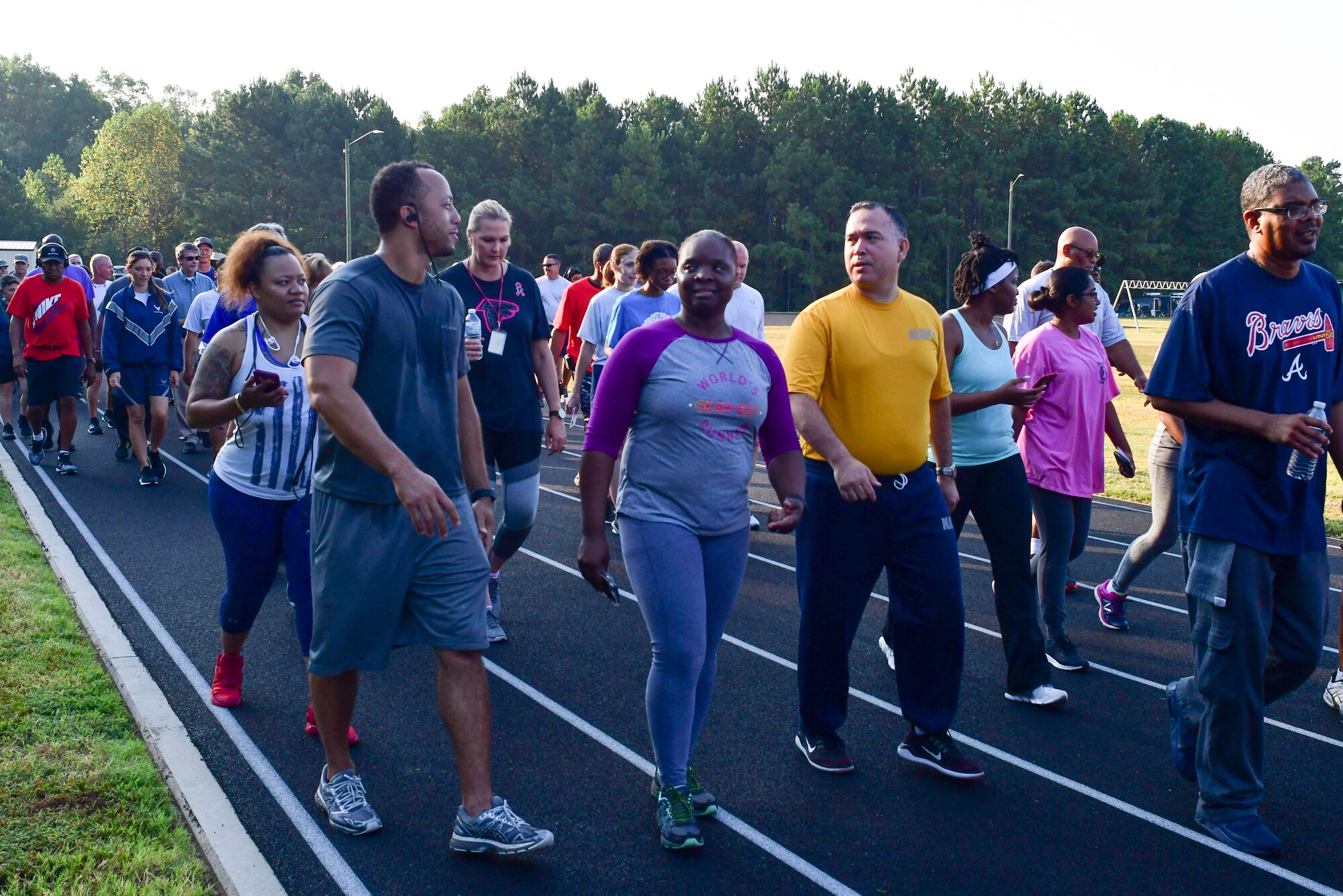 Participants in this year's Sept. 11 Memorial Walk talk with each other as they walk one mile around the base track Sept. 11, 2019 to honor those lost during the terrorist attack.
