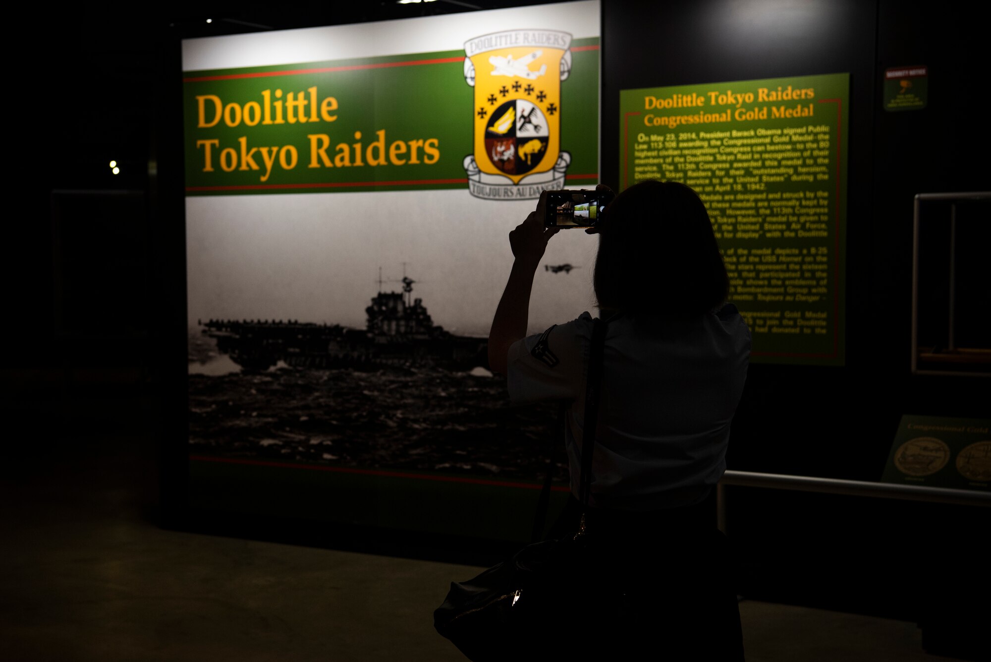 Airman 1st Class Brittany Parsons, 90th Comptroller Squadron financial operations technician, takes a picture of the Doolittle Raid exhibit in The National Museum of the U.S. Air Force Sept. 4, 2019, at Wright-Patterson Air Force Base, Ohio. The museum is 19 acres of indoor viewing space, making it the worlds largest aviation museum. (U.S. Air Force photo by Senior Airman Abbigayle Williams)
