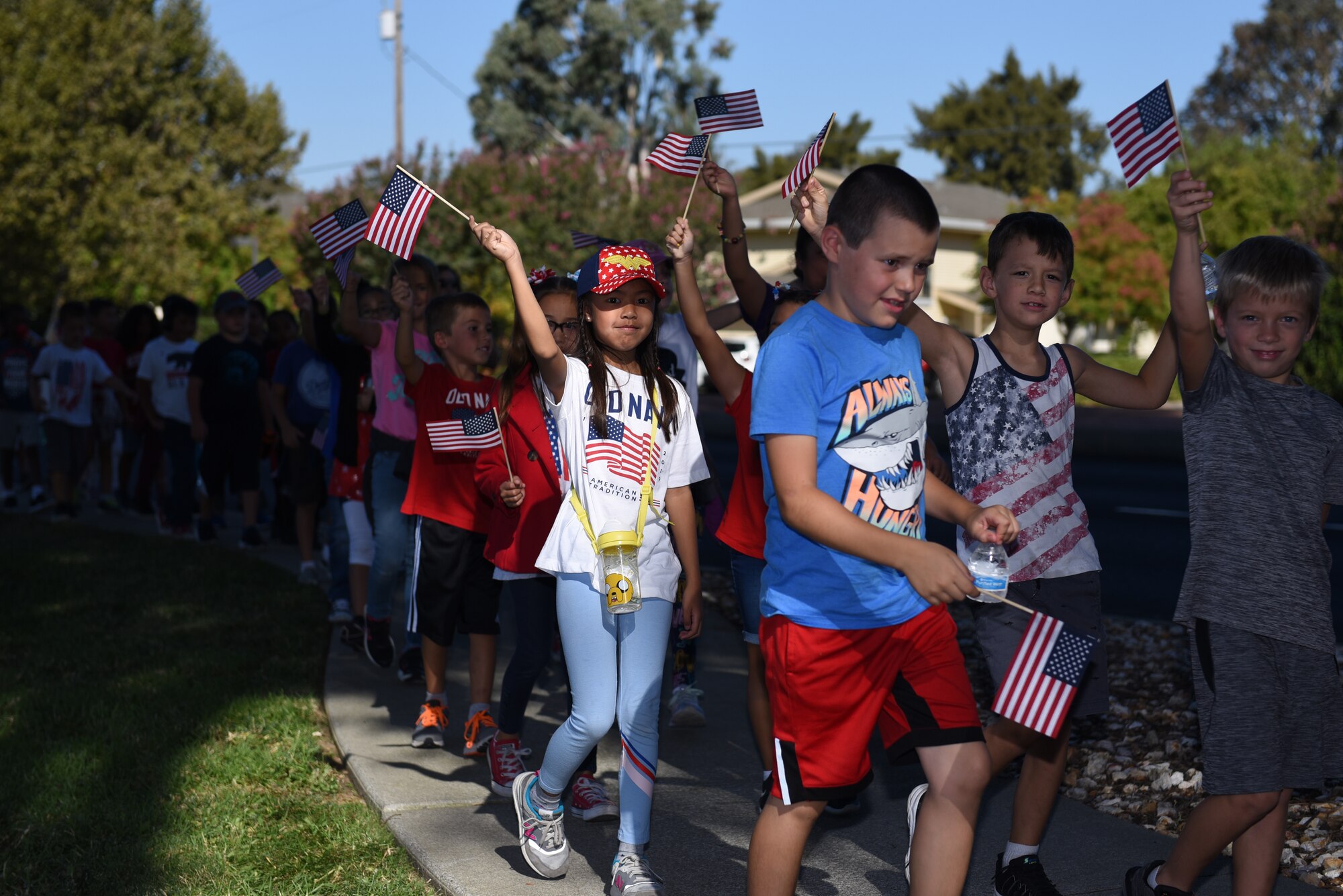 Children participate in the Remembrance Day Freedom Walk Sept. 11, 2019, at Travis Air Force Base, California. The walk commemorated those who lost their lives on 9/11. (U.S. Air Force photo by Airman 1st Class Cameron Otte)