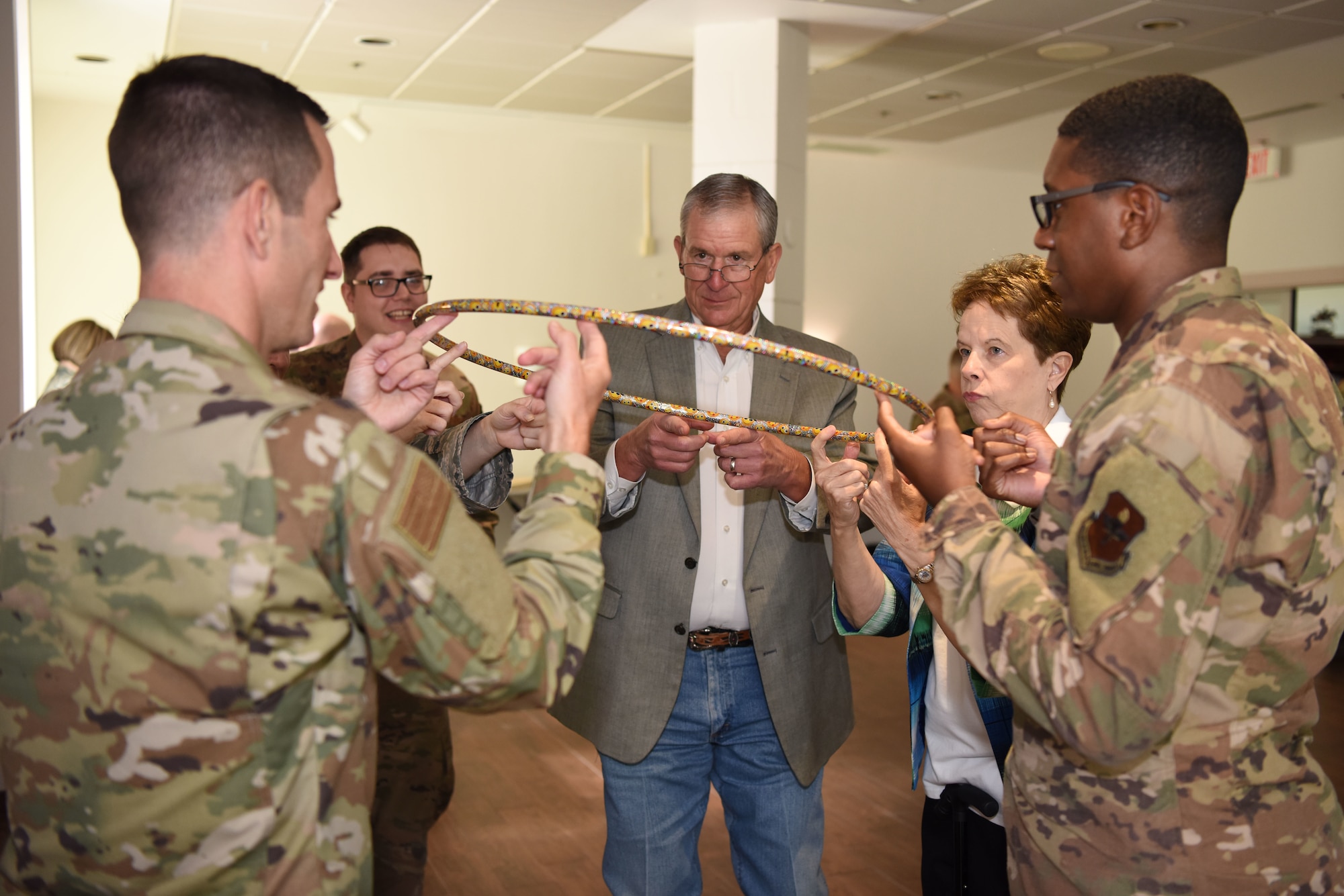 U.S. Air Force personnel and San Angelo officials perform a mental exercise focused on stress and teamwork at the Future of the Air Force Symposium in the event center on Goodfellow Air Force Base, Texas, September 6, 2019. The mental exercises required students to work under both mental and physical stress, they were not told the purpose of the exercises until after they were done. (U.S. Air Force photo by Airman 1st Class Ethan Sherwood/Released)