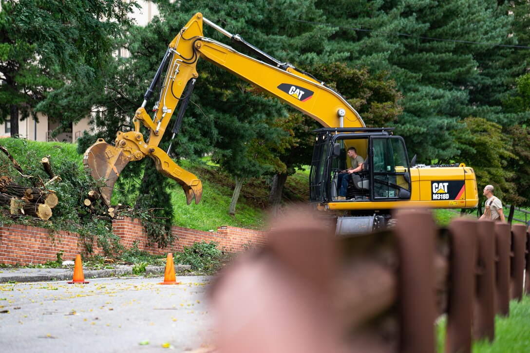 Team Osan’s 51st Civil Engineering Squadron clear debris blown from structures following high winds caused by Typhoon Lingling at Osan Air Base.