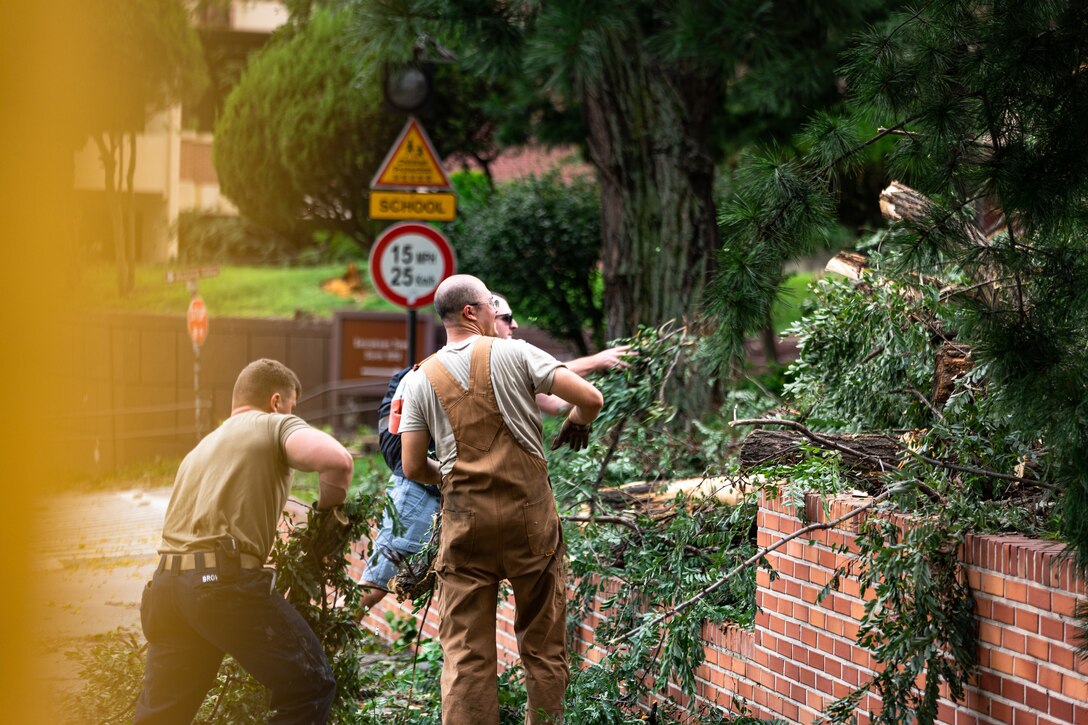 Team Osan’s 51st Civil Engineering Squadron clear debris blown from structures following high winds caused by Typhoon Lingling at Osan Air Base.
