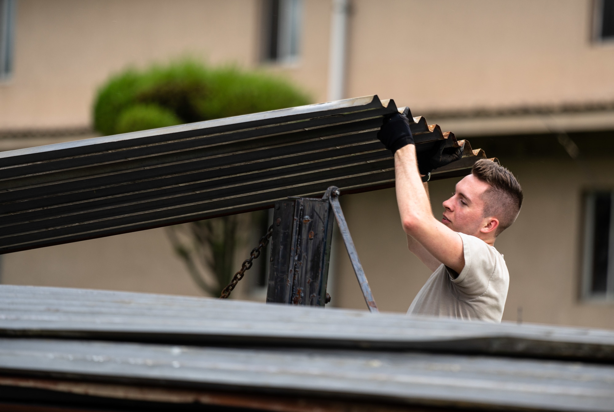 Team Osan’s 51st Civil Engineering Squadron clear debris blown from structures following high winds caused by Typhoon Lingling at Osan Air Base.