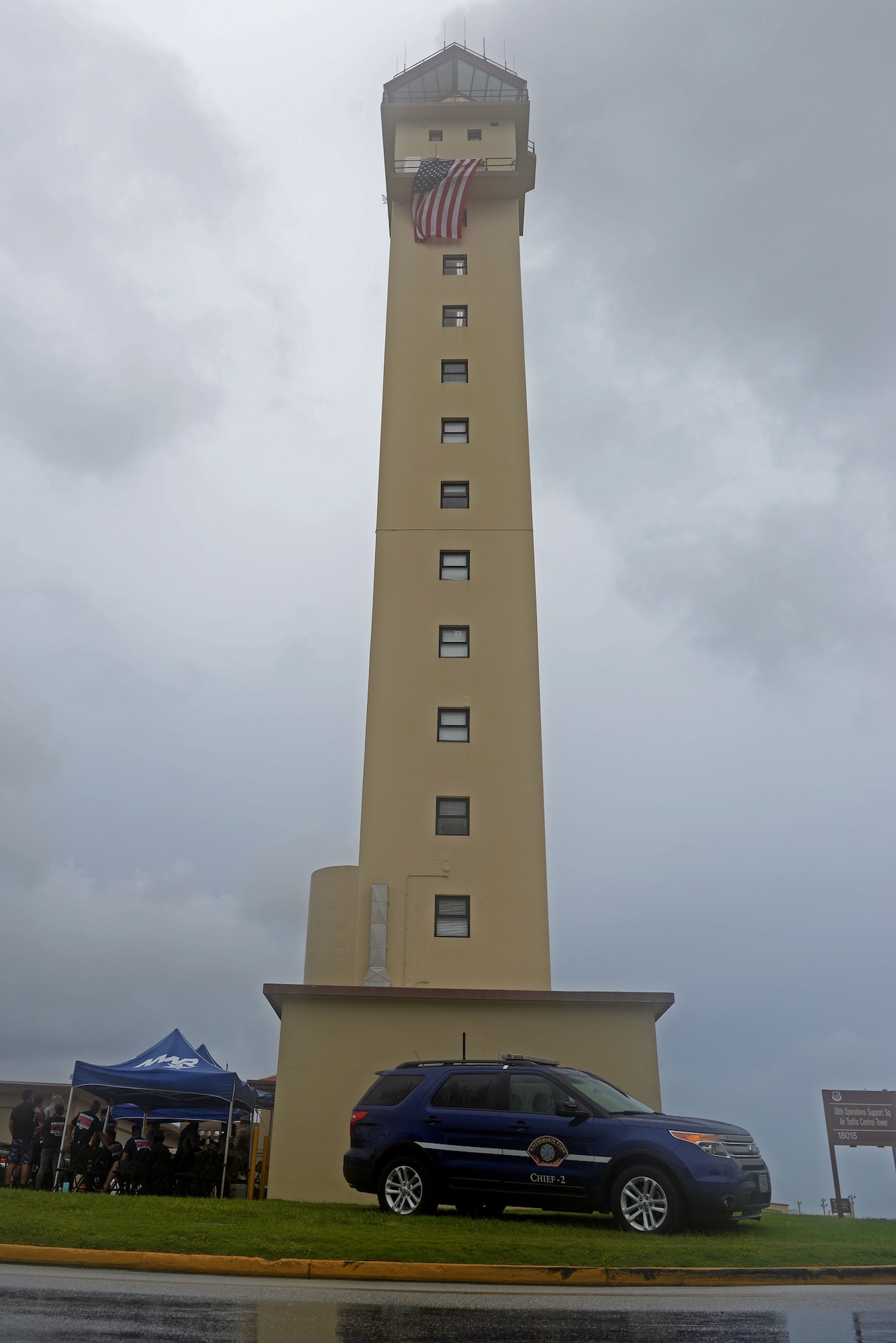 A U.S. flag is flown on the 36th Operation Support Squadron air traffic control tower during a September 11 memorial stair climb event on Andersen Air Force Base, Guam, Sept. 11, 2019.