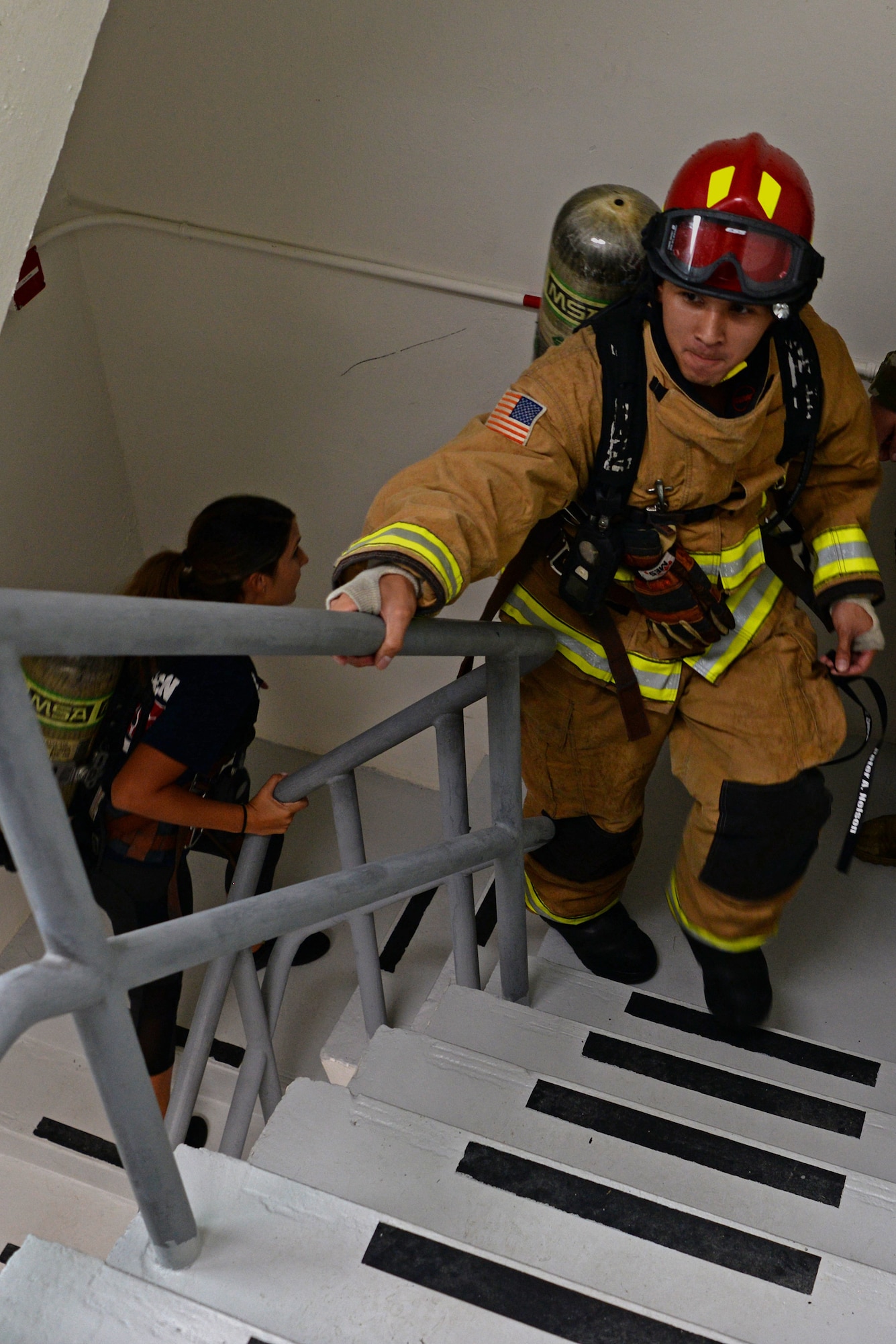A 36th Civil Engineer Squadron firefighter climb the stairs of the 36th Operation Support Squadron air traffic control tower during a September 11 memorial stair climb event on Andersen Air Force Base, Guam, Sept. 11, 2019.