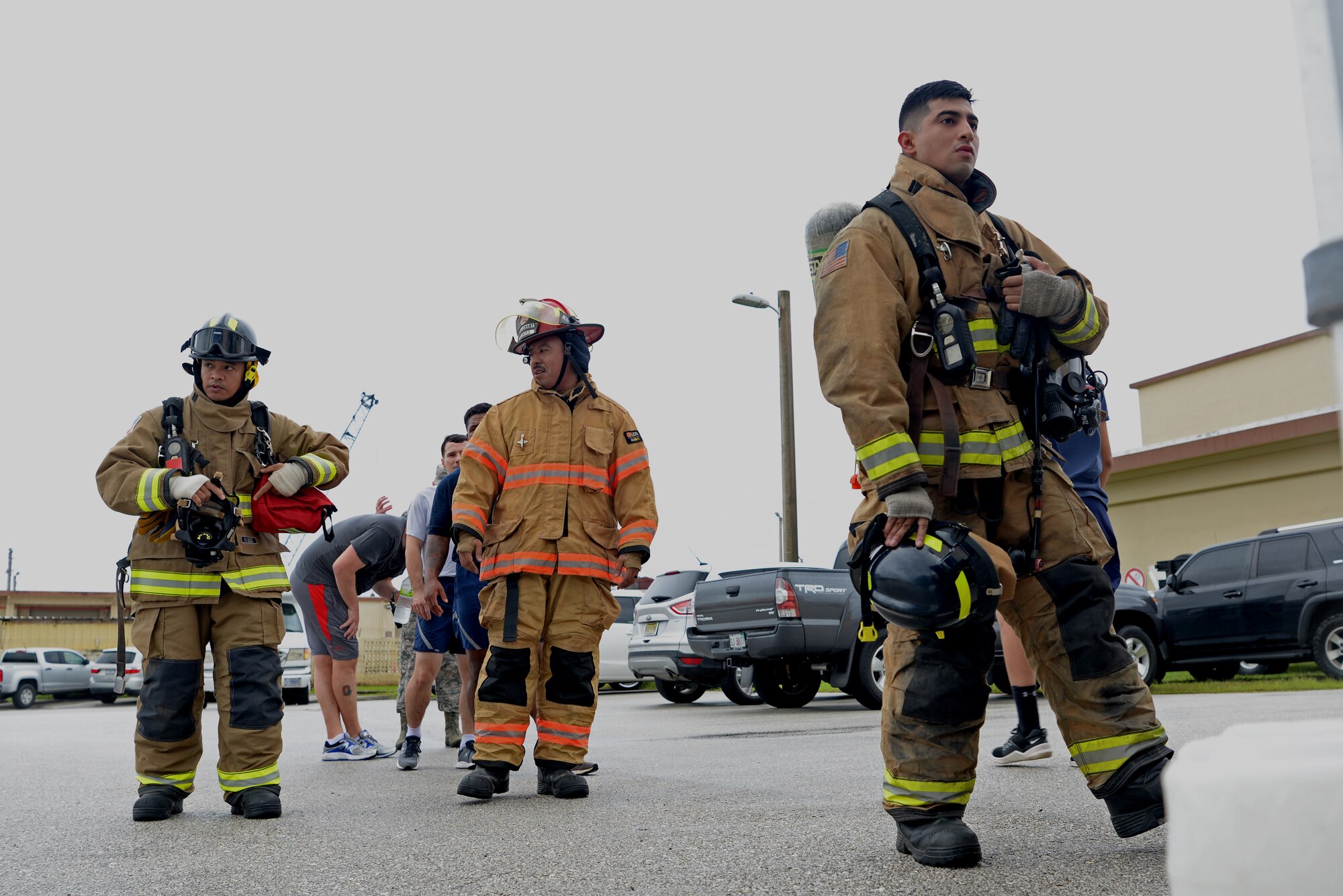 Members of the 36th Civil Engineer Squadron fire department wait to climb the 36th Operation Support Squadron air traffic control tower during a September 11 memorial stair climb event on Andersen Air Force Base, Guam, Sept. 11, 2019.