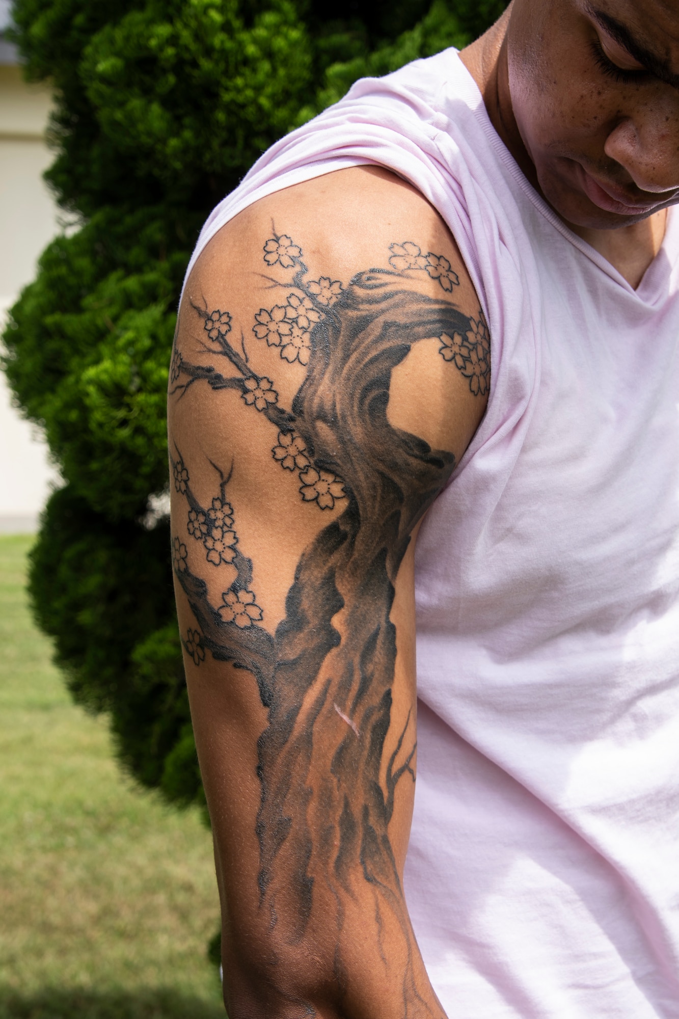 U.S. Air Force Airman 1st Class D’Andre Daniels, a 35th Aircraft Maintenance Squadron crew chief, poses for a photo at Misawa Air Base, Japan, Aug. 8, 2019. In Japanese culture, the cherry blossom represents the fragility and beauty of life. The cherry blossom is a constant reminder that life is overwhelmingly beautiful yet tragically short. (U.S. Air Force photo by Airman 1st China M. Shock)