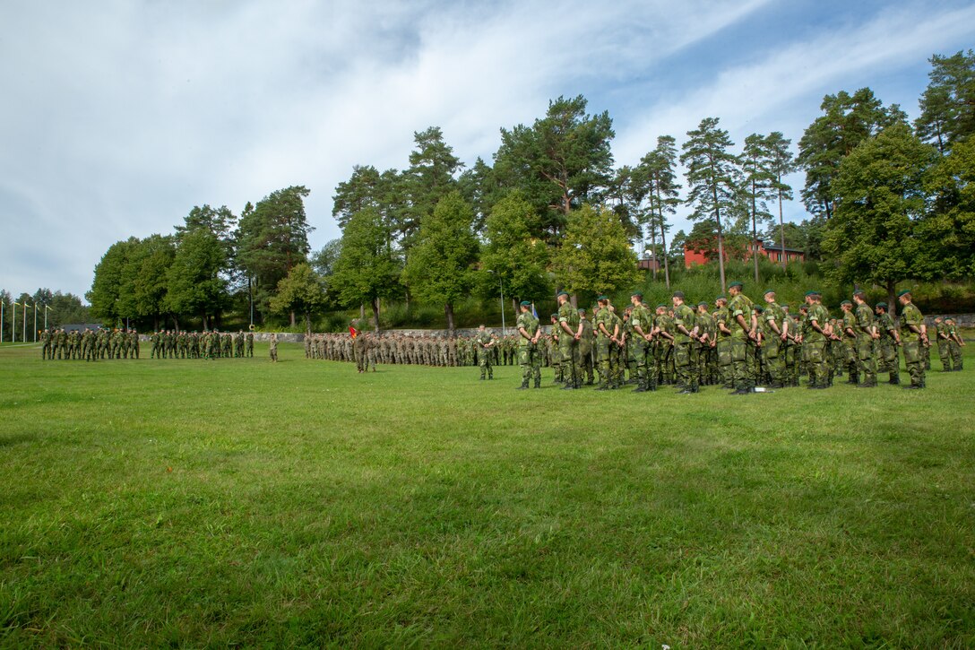 U.S. Marines with 1st Battalion, 8th Marines, Marine Rotational Force–Europe 19.2, Marine Forces Europe and Africa, and Swedish Marines from 1st Marine Regiment, conduct a closing ceremony during Exercise Archipelago Endeavor 19 in the Berga Naval Base, Sweden, Aug. 30, 2019.