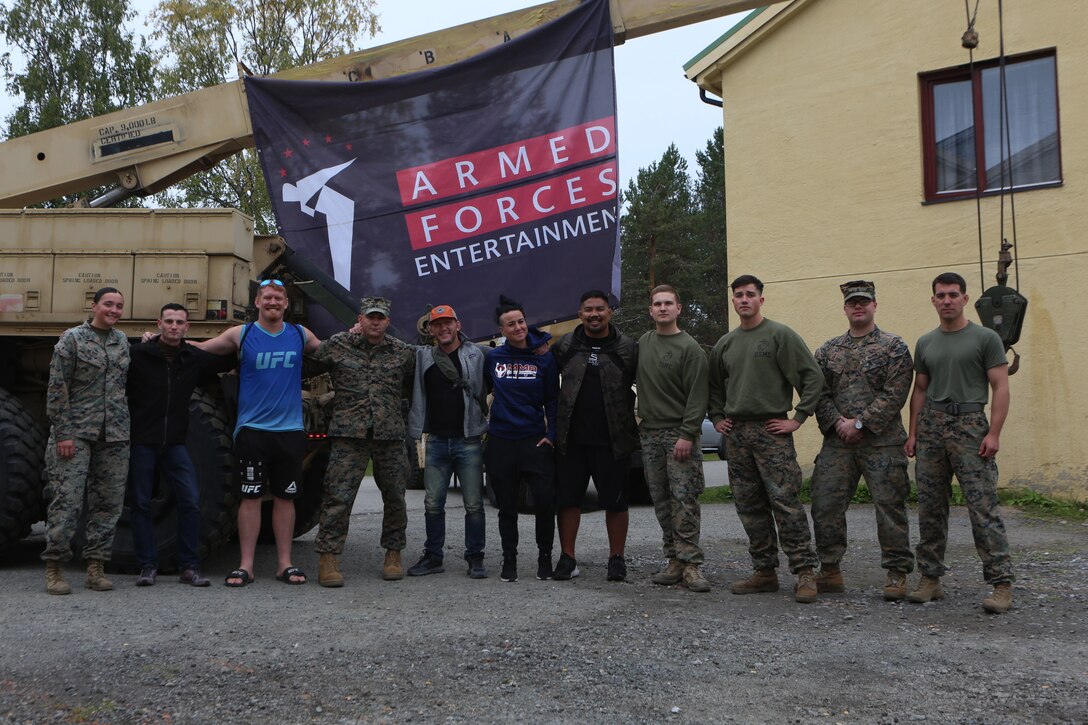 UFC fighters Sam Alvey, Gray Maynard, Ashlee Evans-Smith and Mark Munoz pose for a photo alongside U.S. Marines with Marine Rotational Force-Europe 19.2, Marine Forces Europe and Africa, during an Armed Forces Entertainment tour visit in Setermoen, Norway, Sep. 5, 2019