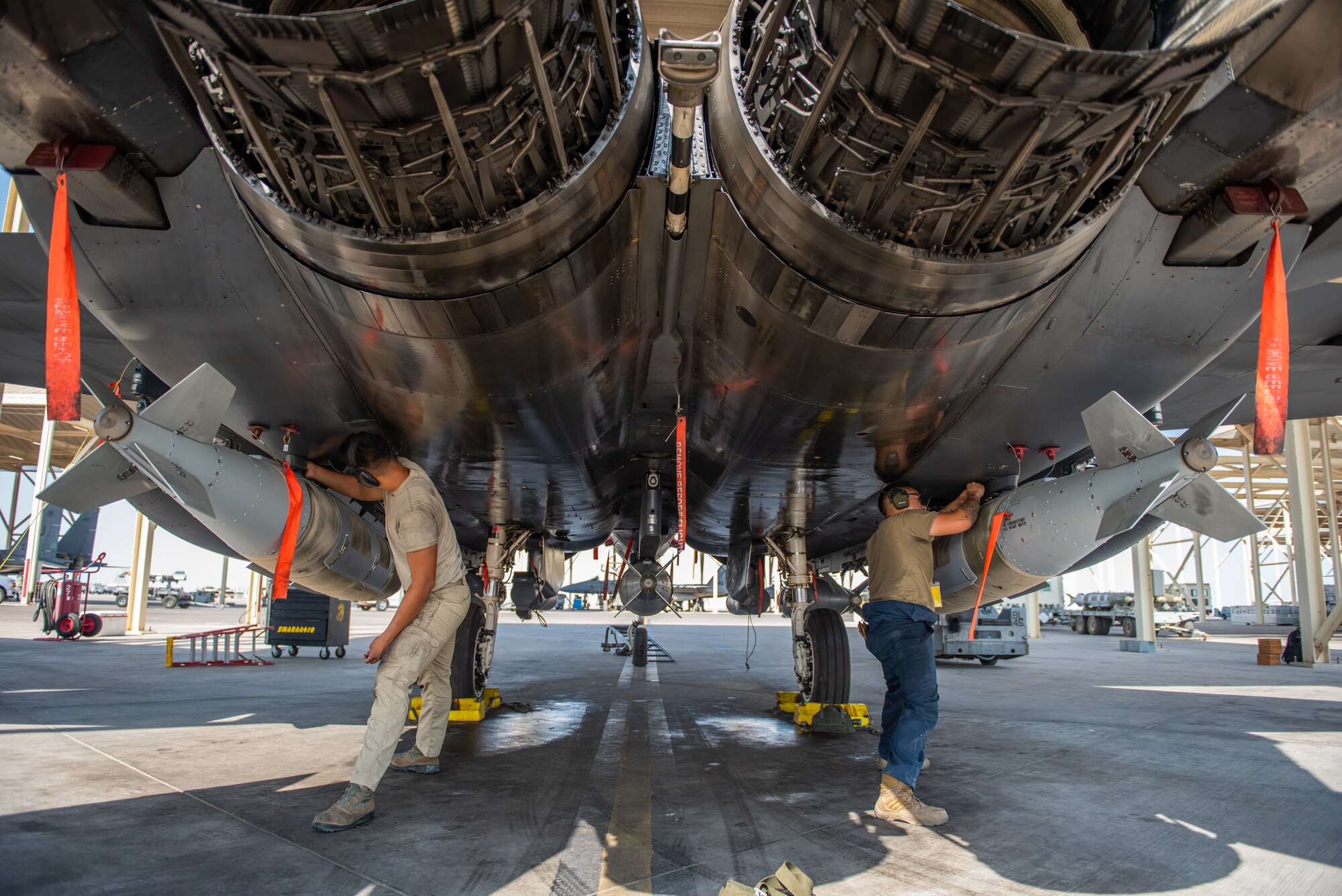 380th Expeditionary Aircraft Maintenance Squadron weapons load crew members inspect recently attached GBU-31s on an F-15E Strike Eagle Sept. 9, 2019, at Al Dhafra Air Base, United Arab Emirates, in preparation for a Coalition and Iraqi Counter-Terrorism Service air strike conducted in the Salah ad Din Province, Iraq, Sept. 10.  (U.S. Air Force Photo by Staff Sgt. Chris Thornbury)